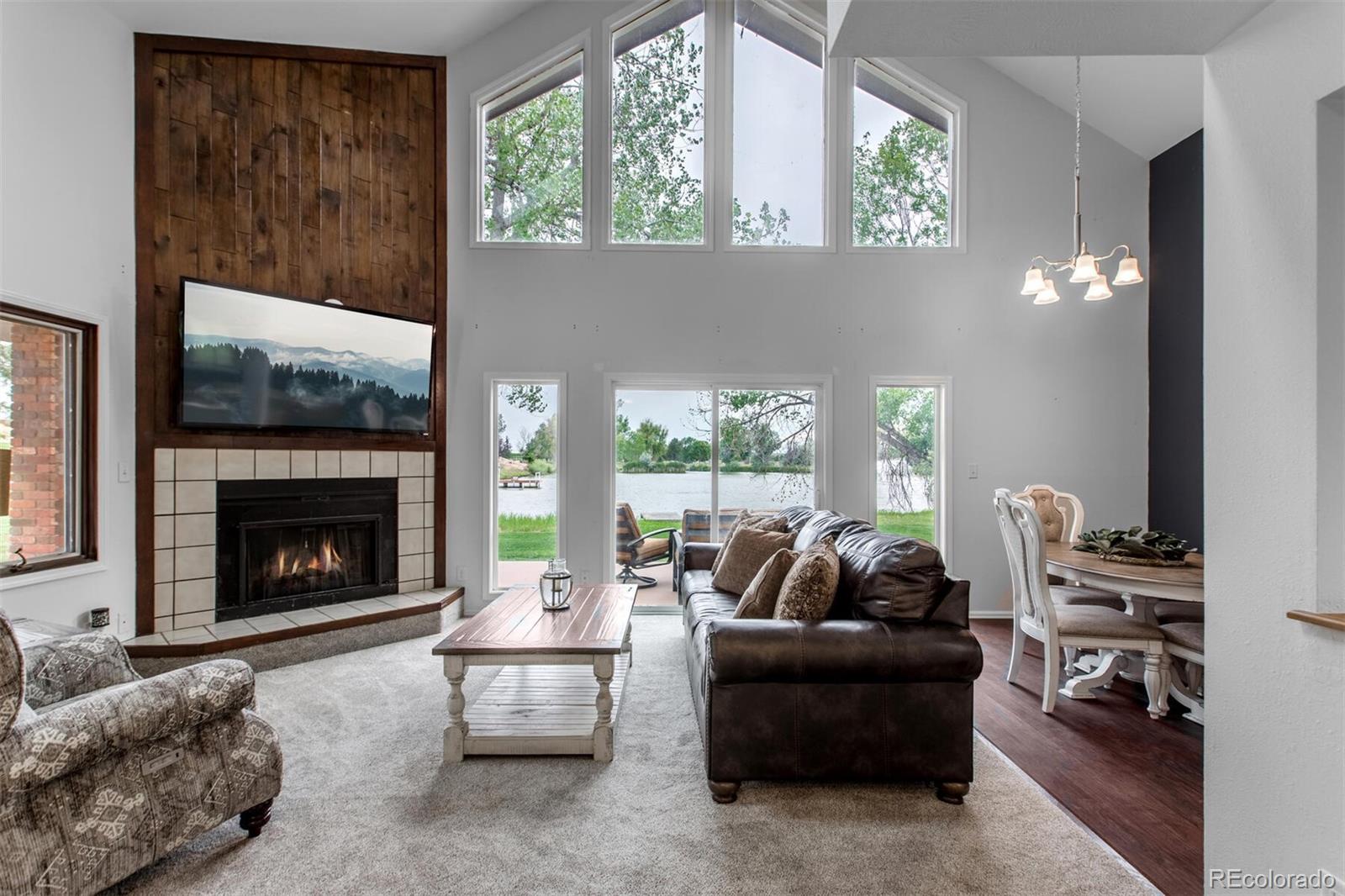 Interior living space of the Lake House overlooking the lake. This house includes a full kitchen, main floor bedroom and full bath as well as upper lofted bedroom (it is huge) and full bath plus laundry. So ideal!