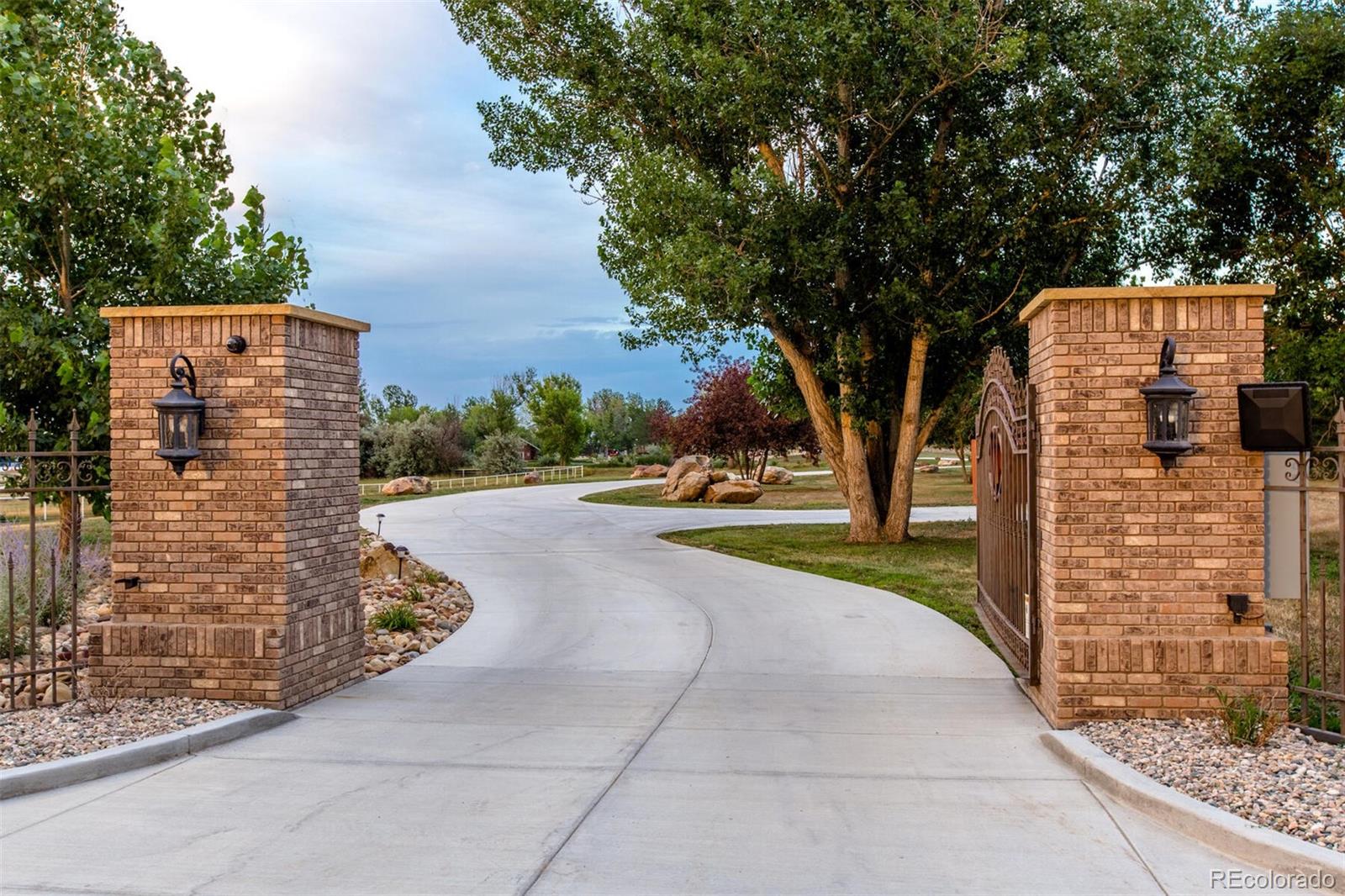 Private and gated estate with high-end security. The winding driveway leads you over 9+ pristine acres