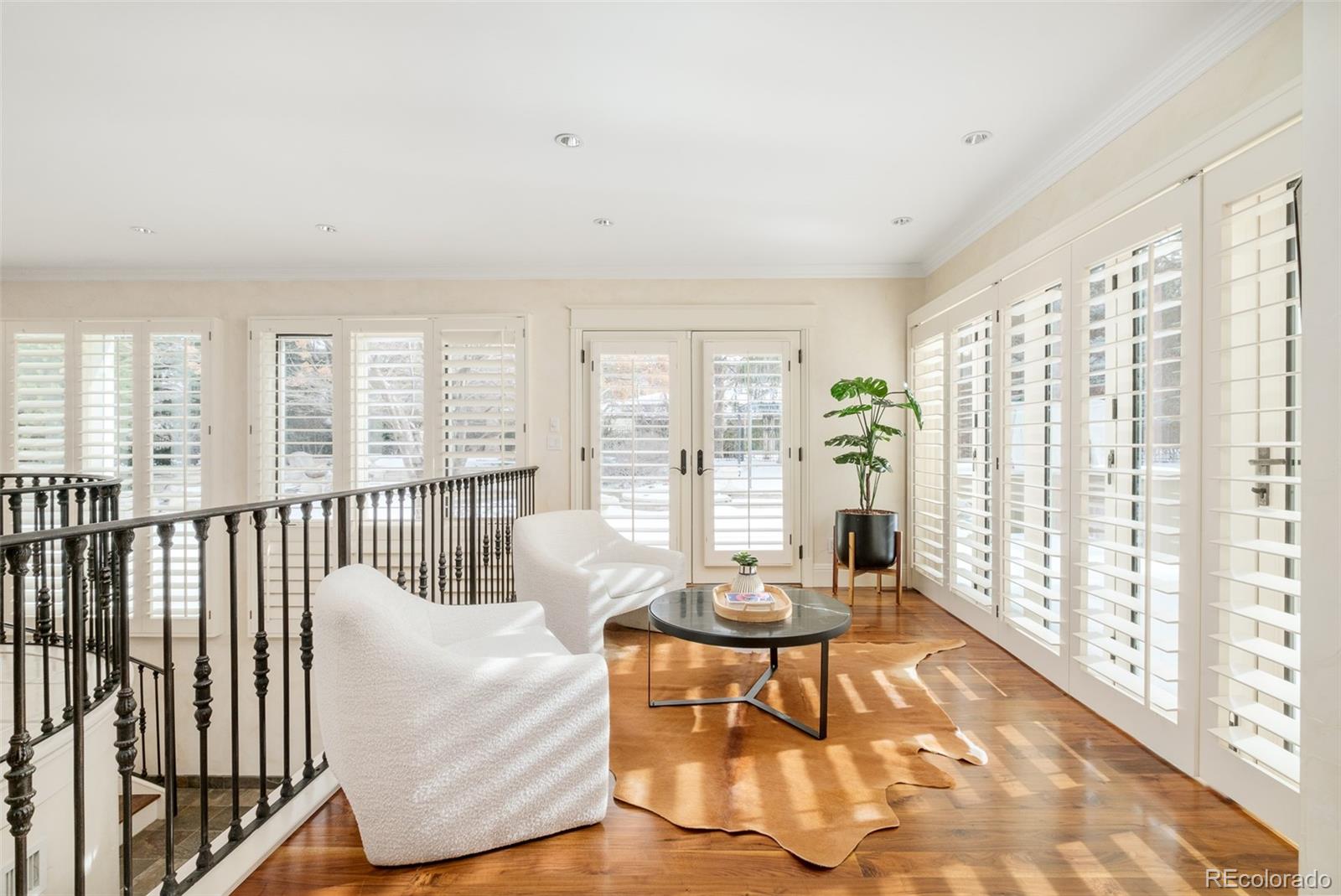 Sun room has access to the outdoor kitchen for ease of entertaining