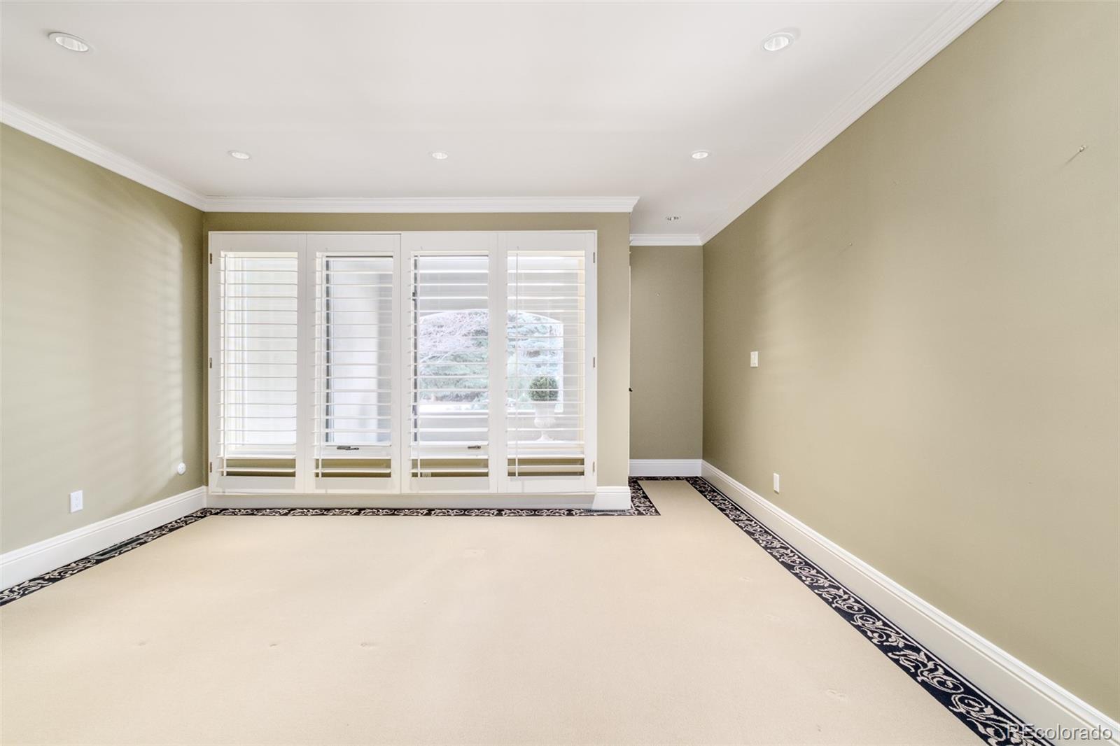 Main level bedroom with en-suite bathroom and access to private patio