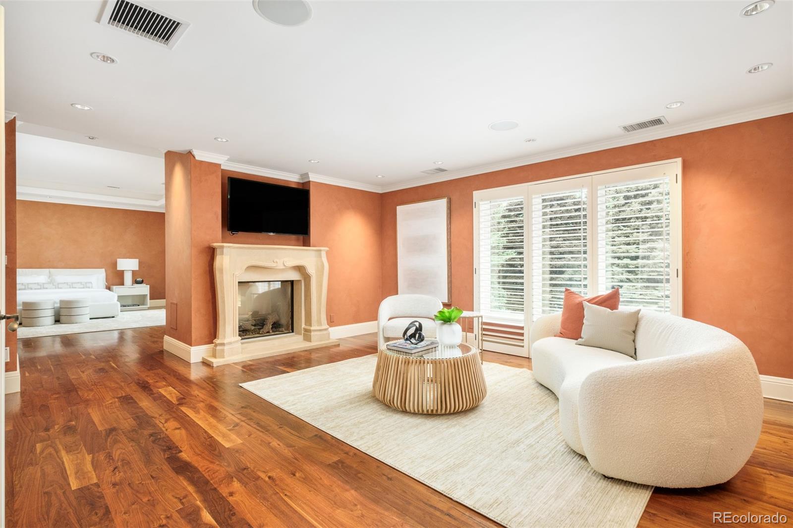 Primary suite sitting room with two-sided fireplace