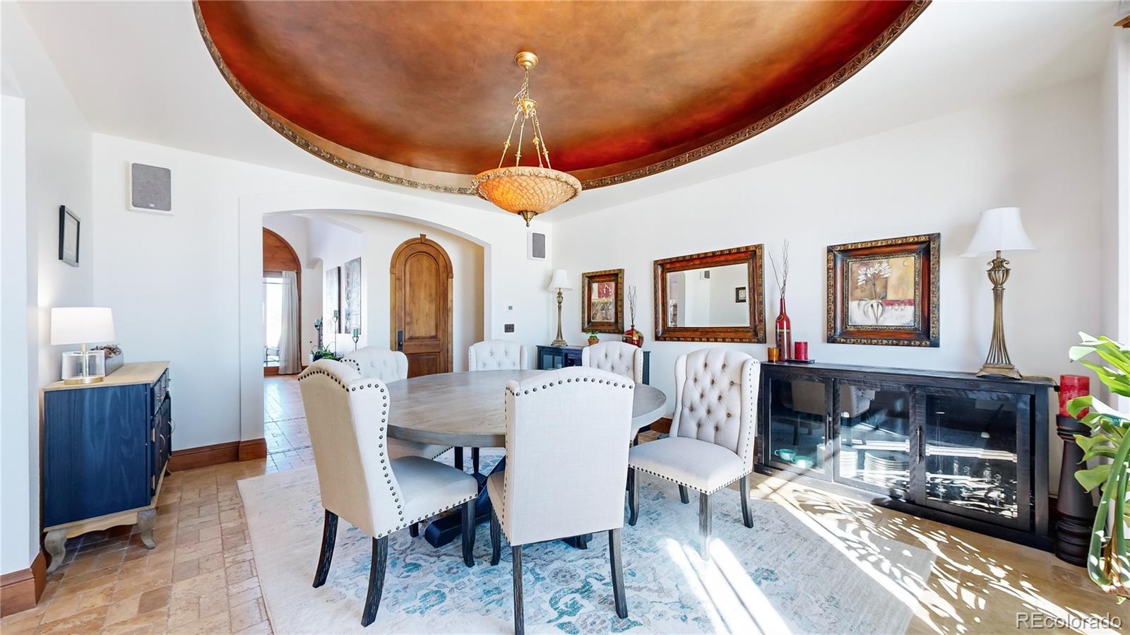 Dining Room with 9 ft ceilings, mountain/valley views and vaulted oval ceiling with lights and built-in speakers.