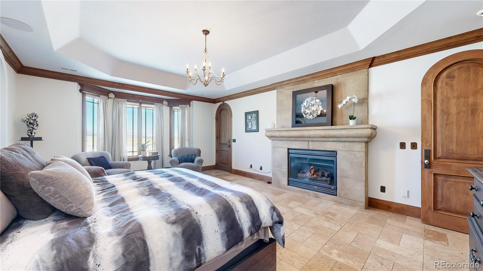 Primary bedroom with gas fireplace and two walk-in closets (14x10 and 11x10)