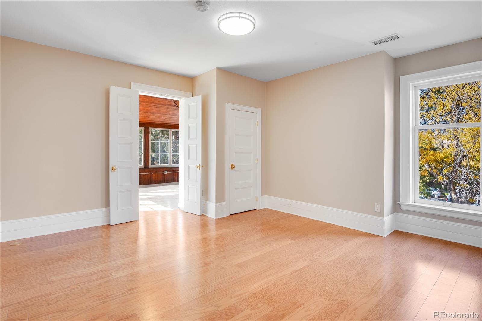 bedroom with sunroom attached