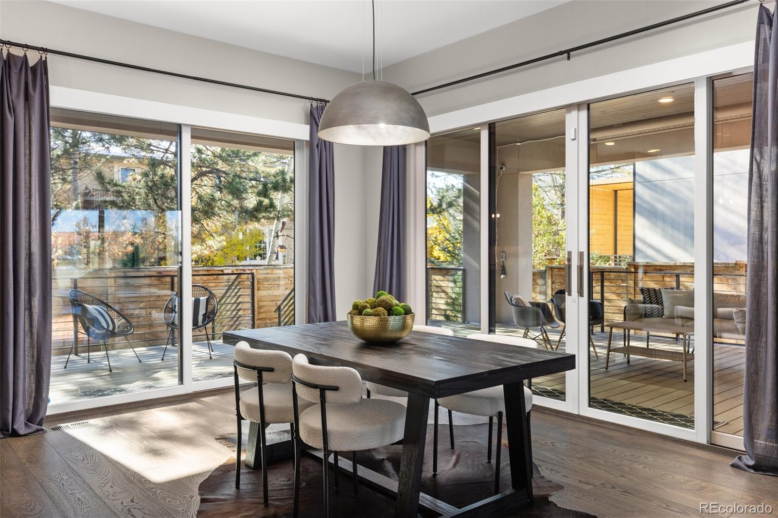 Bright dining area that extends out to covered porch