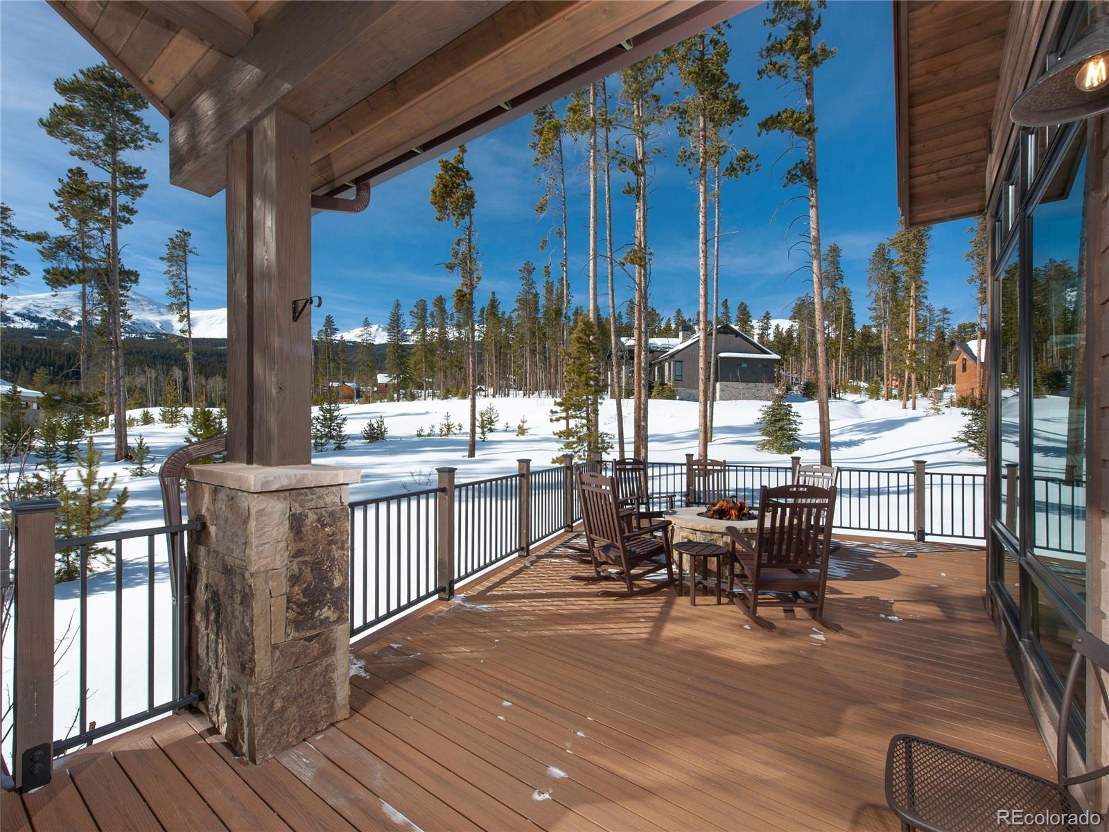 Oversized deck for entertaining with a custom Ironworks Log Firepit