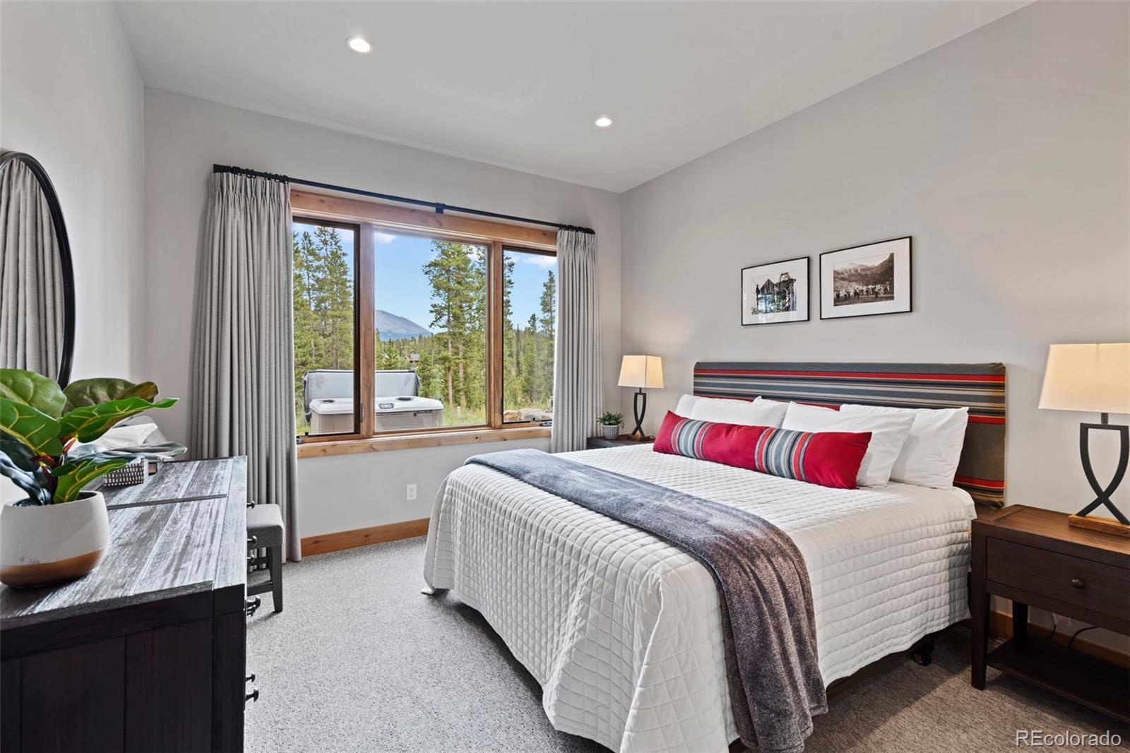 Ensuite guest bedroom with a full bath and walk-in closet.