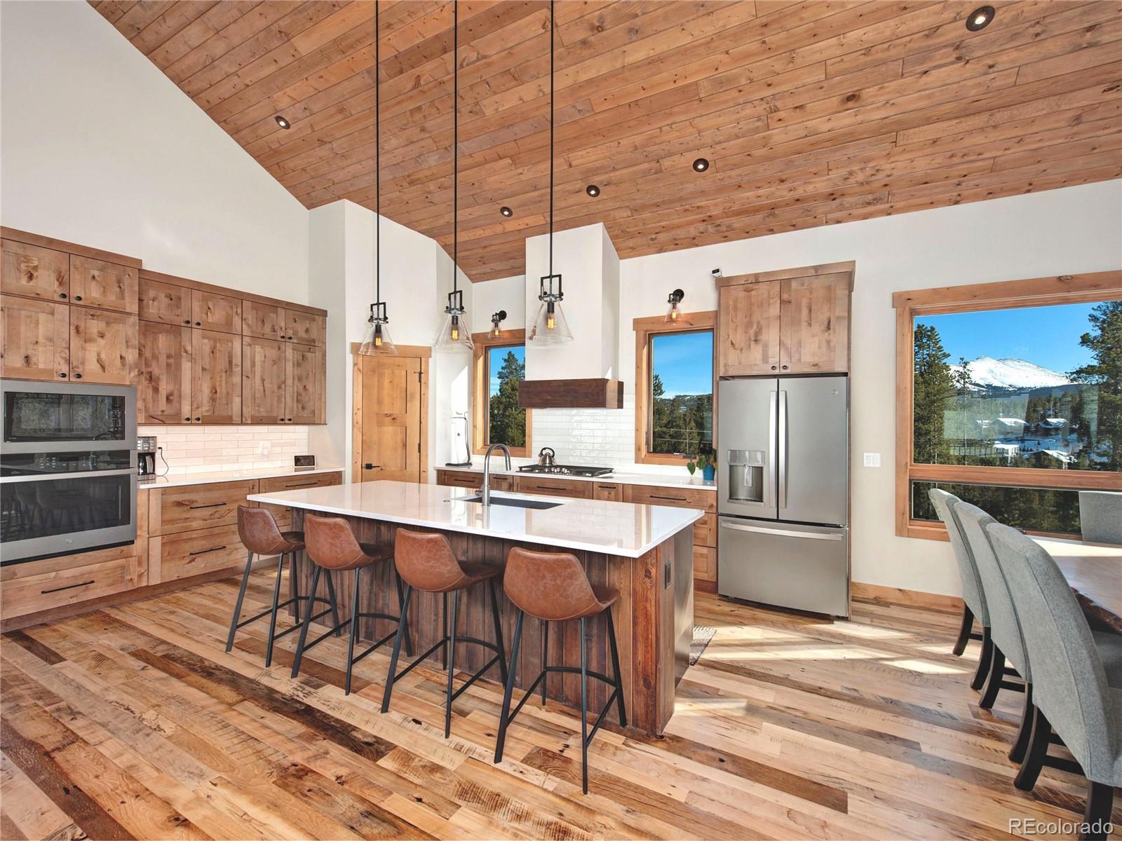 What a view! Snow-capped mountains out every window. A modern organic feel with knotty alder cabinets and warm quartz countertops.