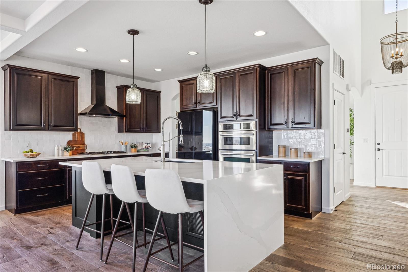 High-end quartz, waterfall edge, updated backsplash