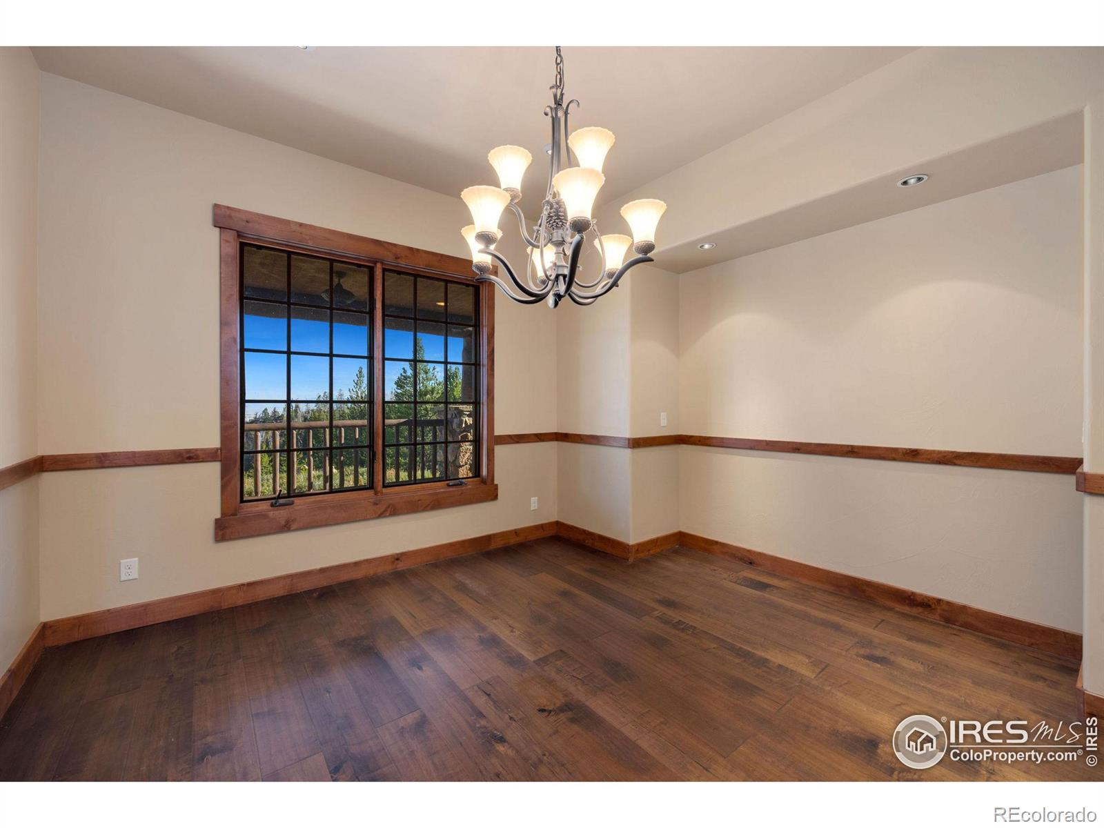 Views from the formal dining area look across the peaks and over the valley to the south east