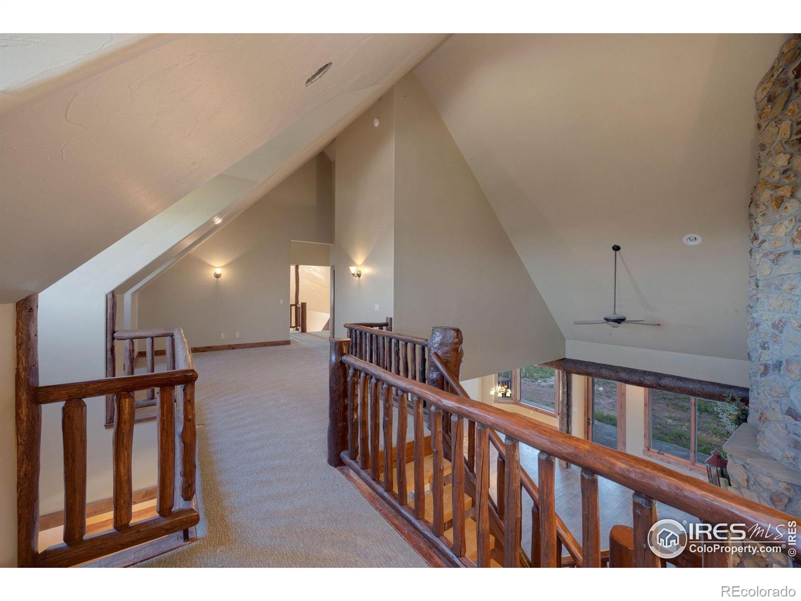 View from entry of second bedroom back toward the third bedroom and over to the large great room