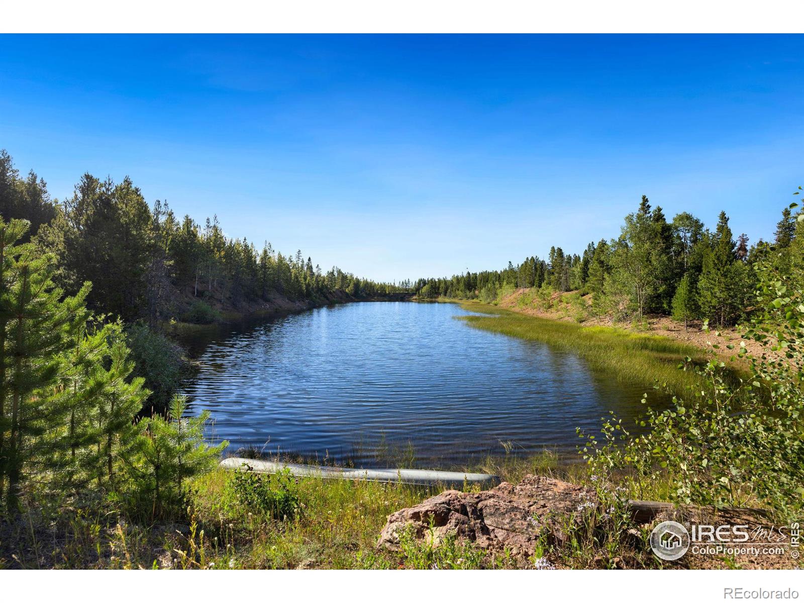 View of large lake stocked with brown and rainbow trout