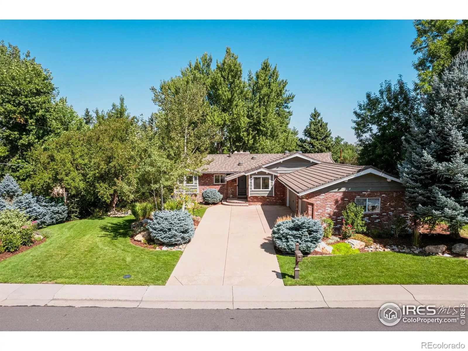 Perfectly placed in the picturesque Applewood neighborhood, this enchanting cottage exudes timeless charm and irresistible curb appeal greeting you with a vision of storybook beauty framed by lush greenery and a symphony of blooming flowers.