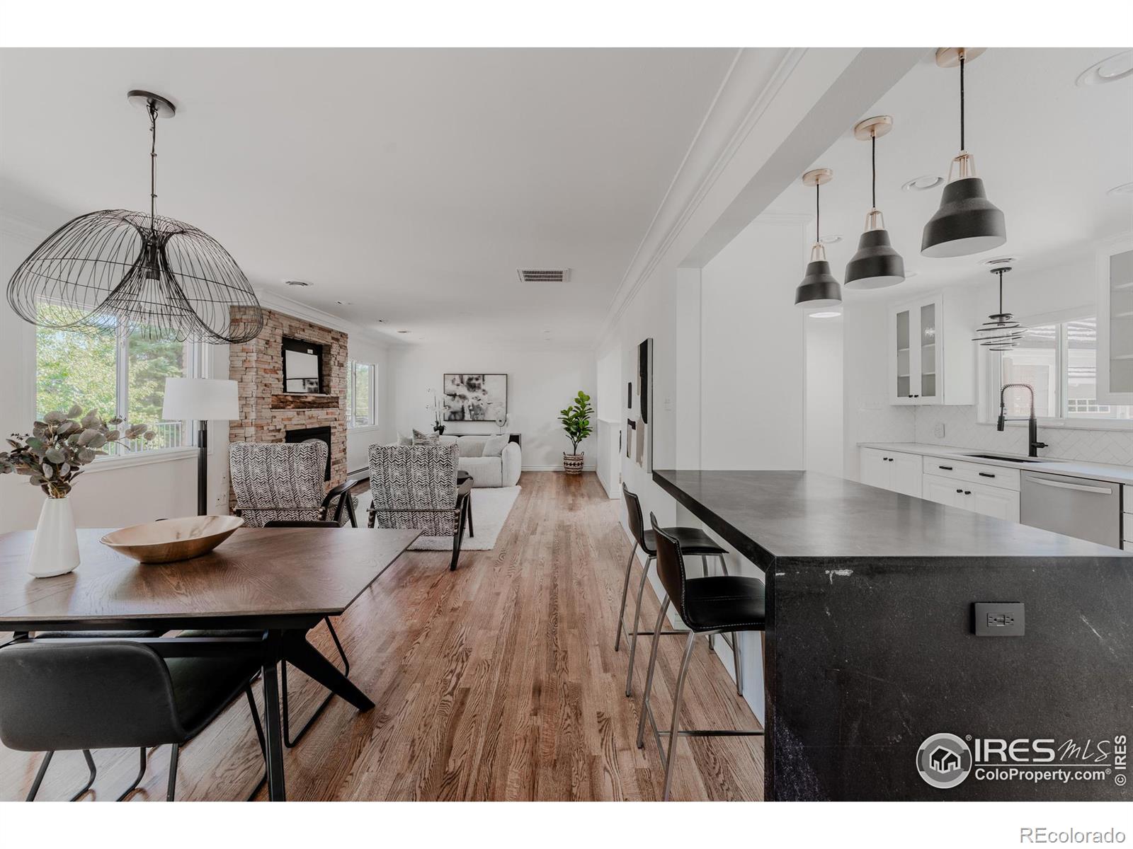 Generous seating space at the kitchen bar and dining area ensures that the space is comfortable and inviting, perfect for hosting gatherings or enjoying everyday meals.