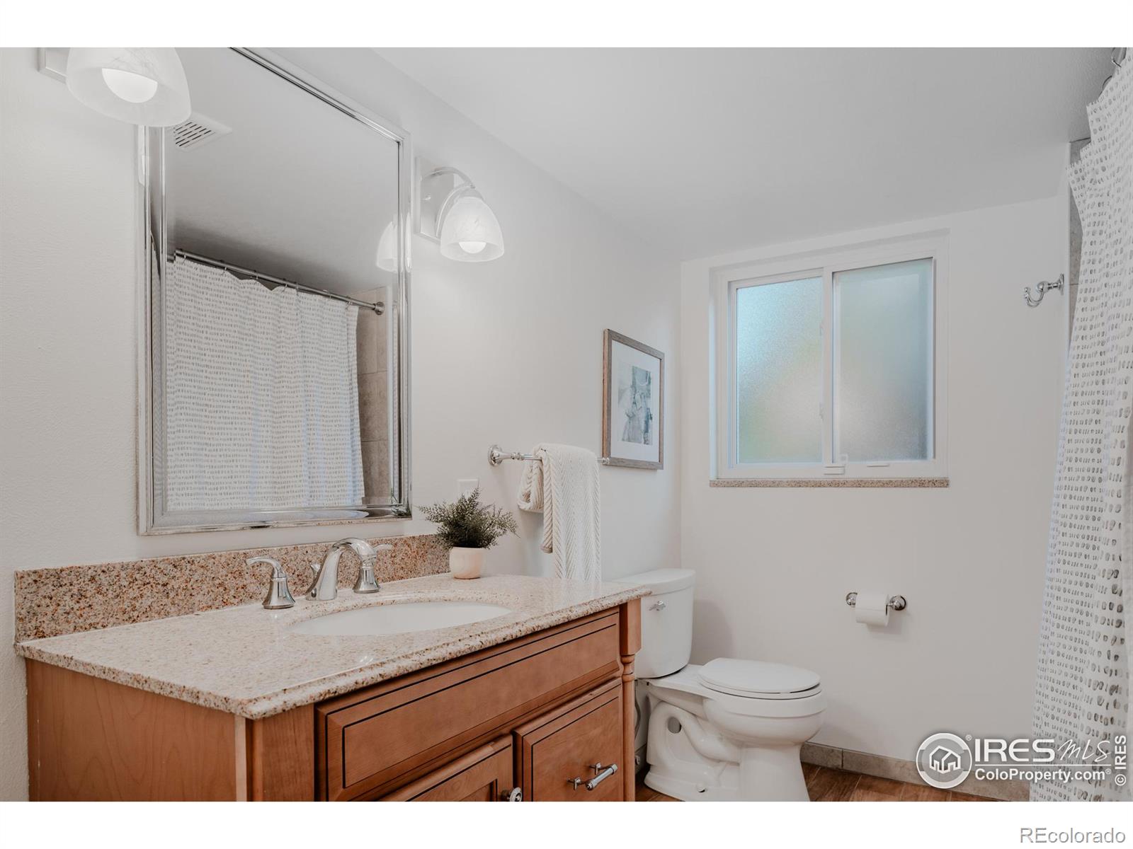 A full shared basement bathroom combines practicality with style to accommodate multiple users with ease.