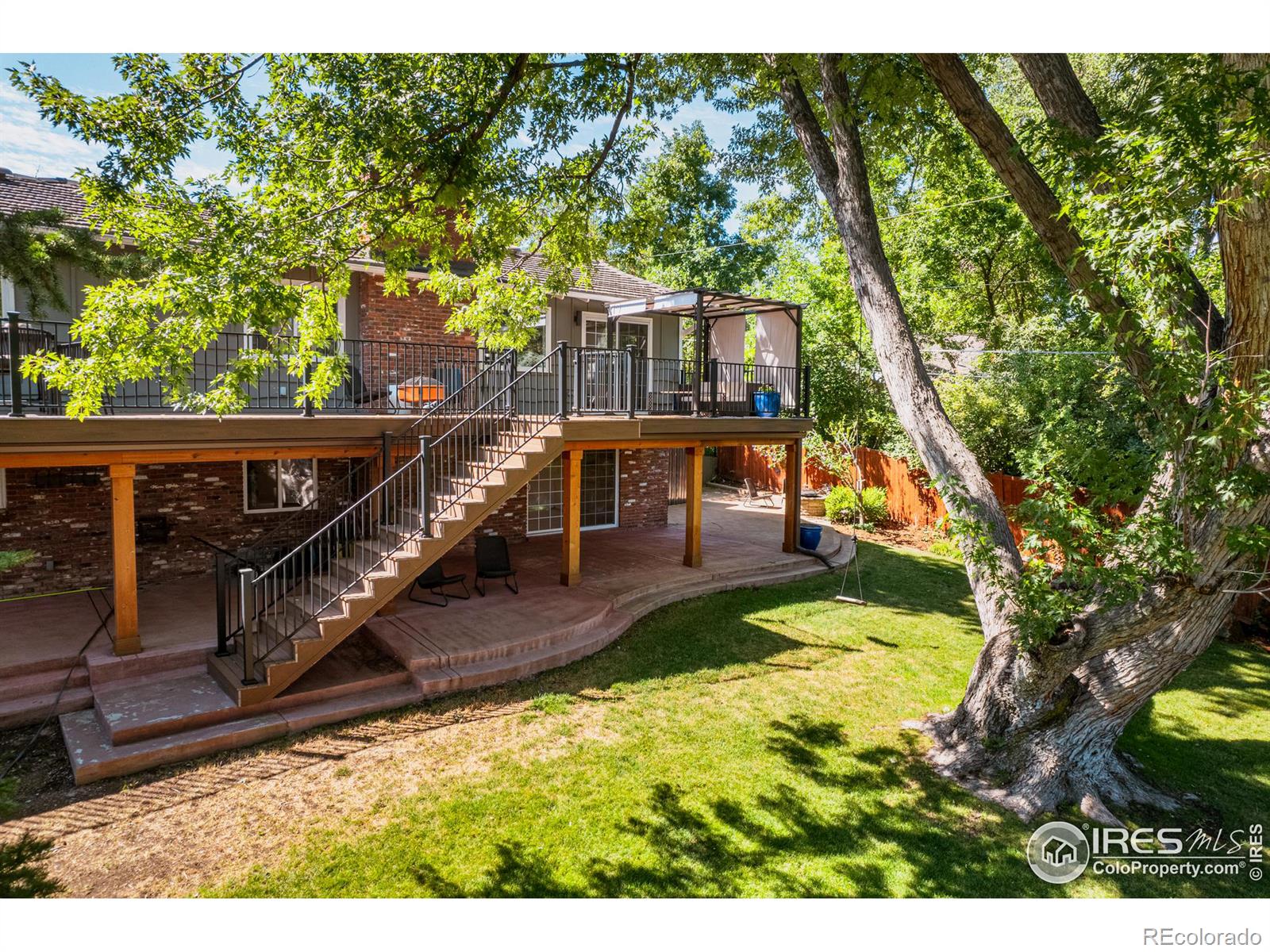 A magnificent deck spans the entire length of the home, complemented by multiple inviting patios, each designed for hosting lively gatherings and intimate celebrations.