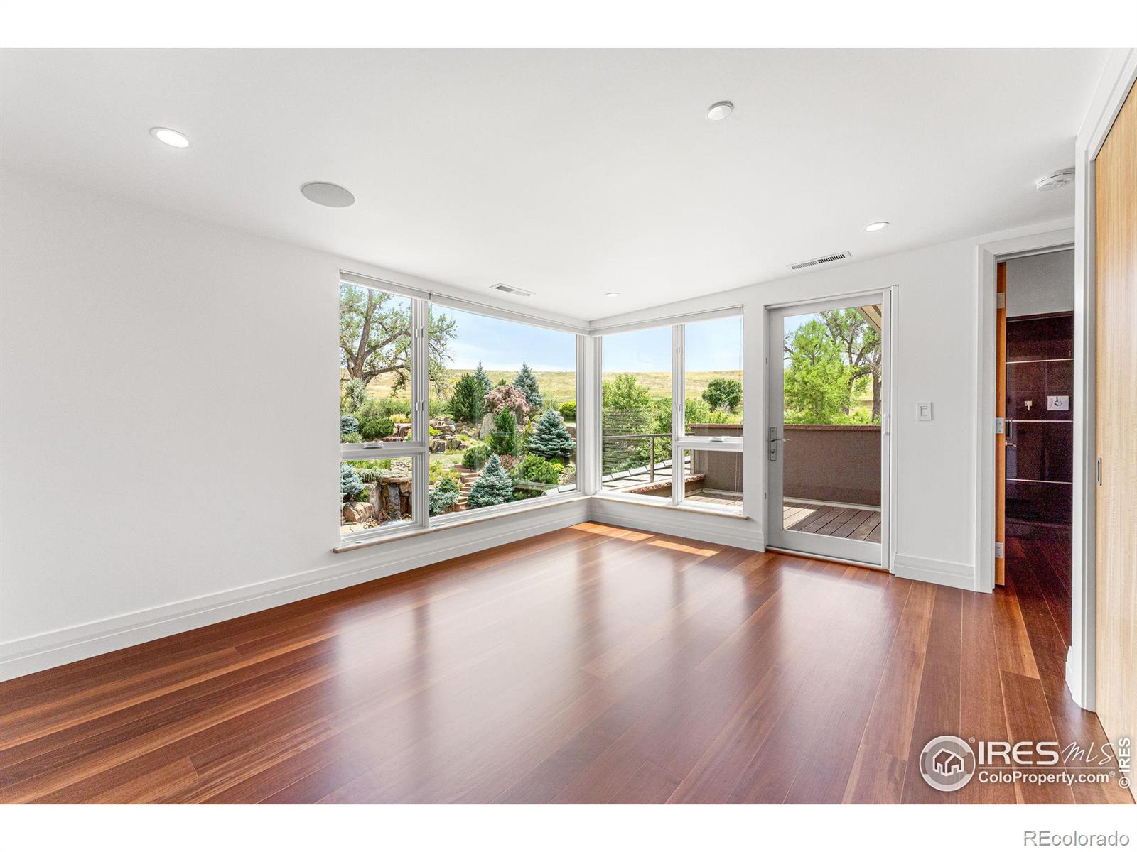 Upstairs guest bedroom with private balcony