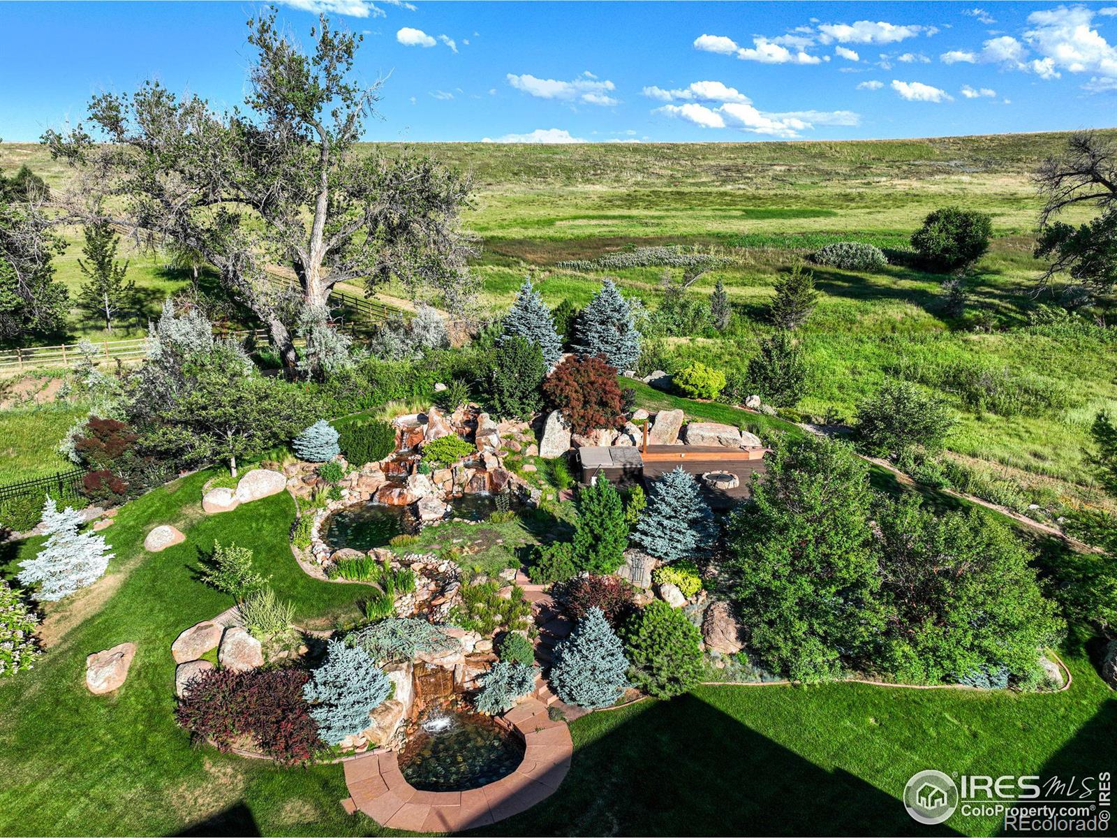 Multi-level water feature behind the home offer idyllic spaces to relax and entertain