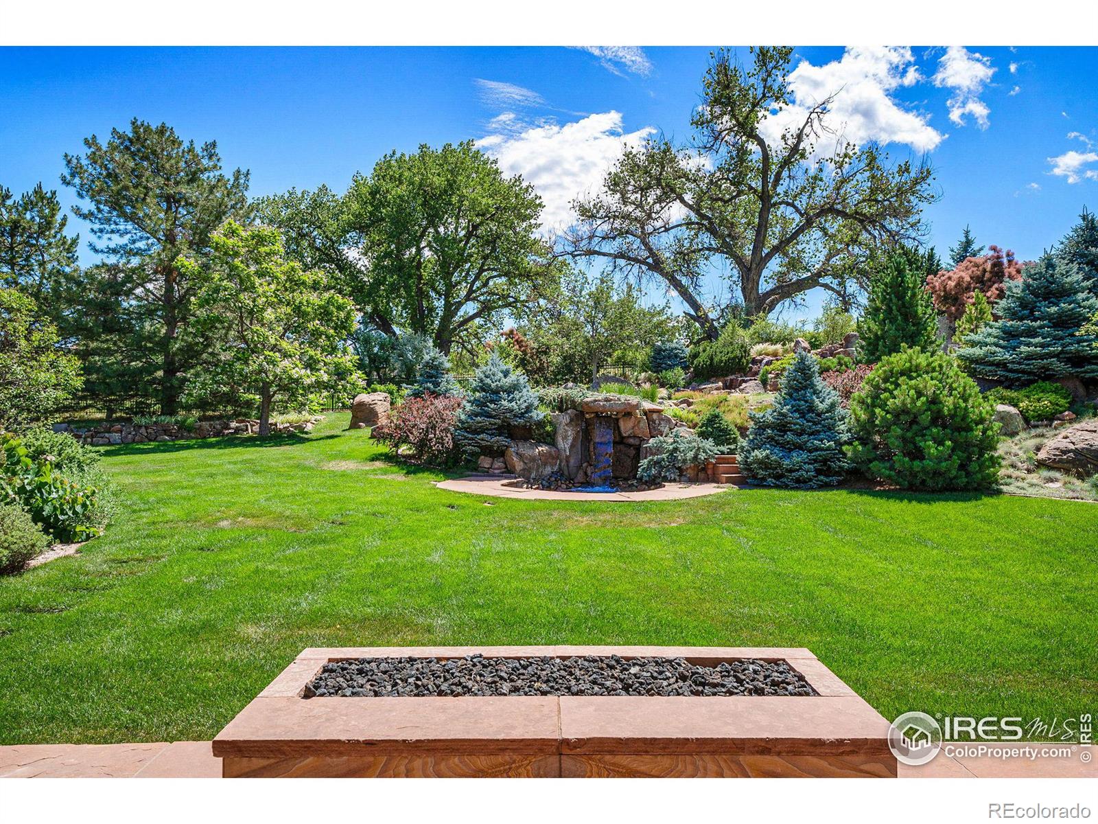 Gas fire pit in backyard covered patio area off the kitchen