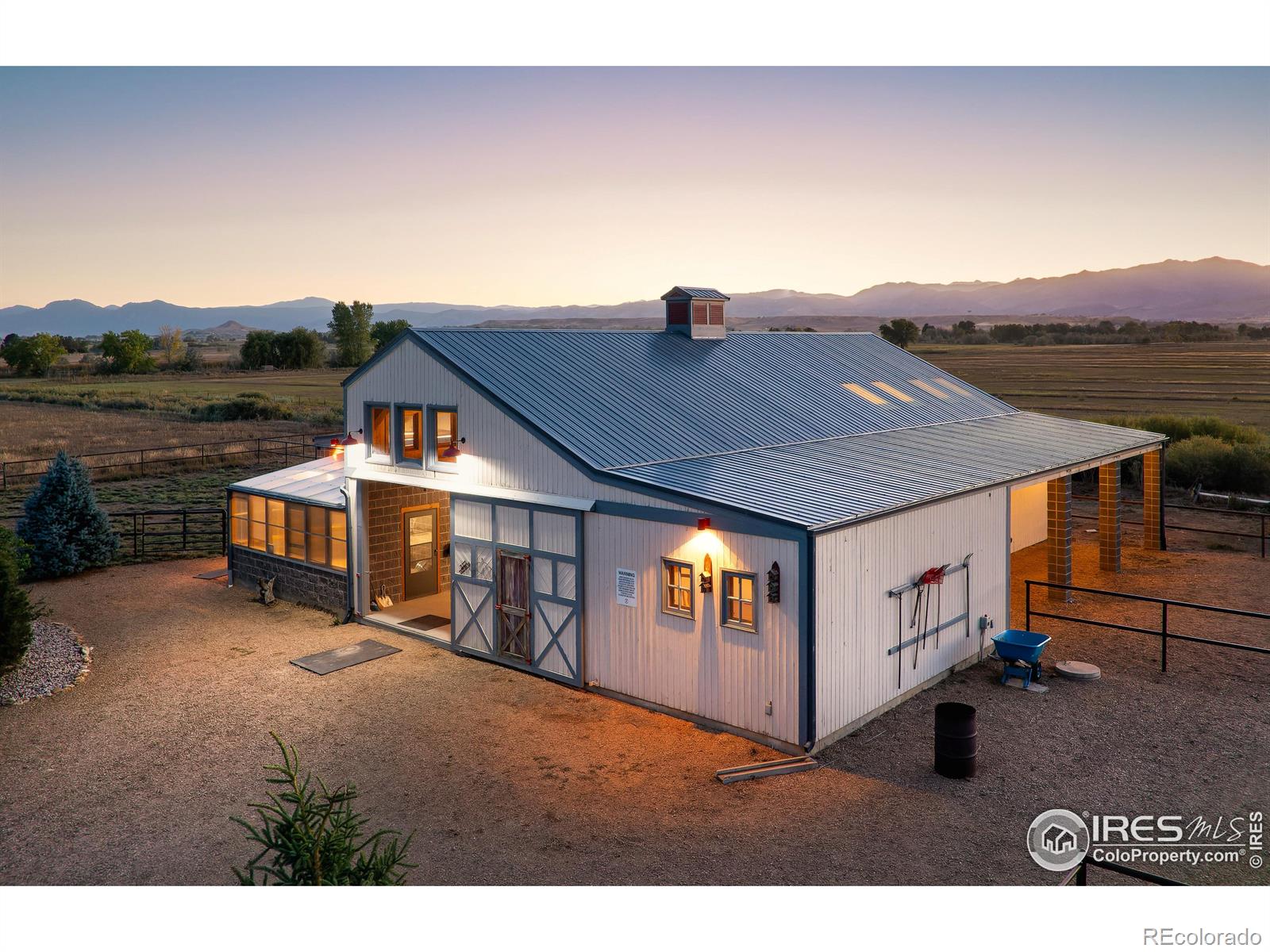 61 acres w/ flowing water rights, hay fields, arena, barn, paddock, southwestern style home, shed, ADU and protected by Boulder County Conservation easements to the north and private farmland to the west