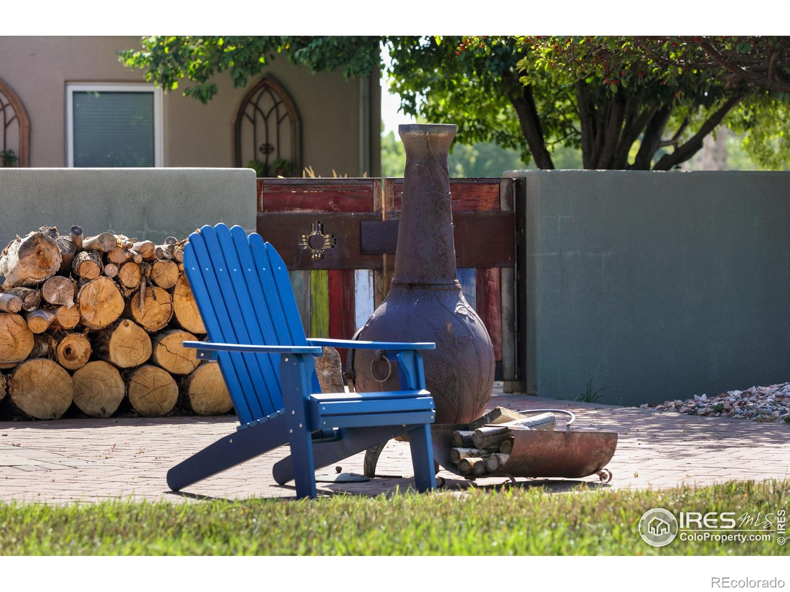 One of 3 outdoor seating areas. Back, west facing patio with the central courtyard access on the right.