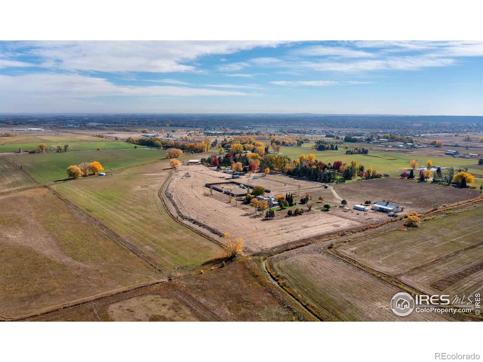 61 acres w/ flowing water rights, hay fields, arena, barn, paddock, home, shed, ADU and protected by Boulder County Conservation easements to the north and private farmland to the west