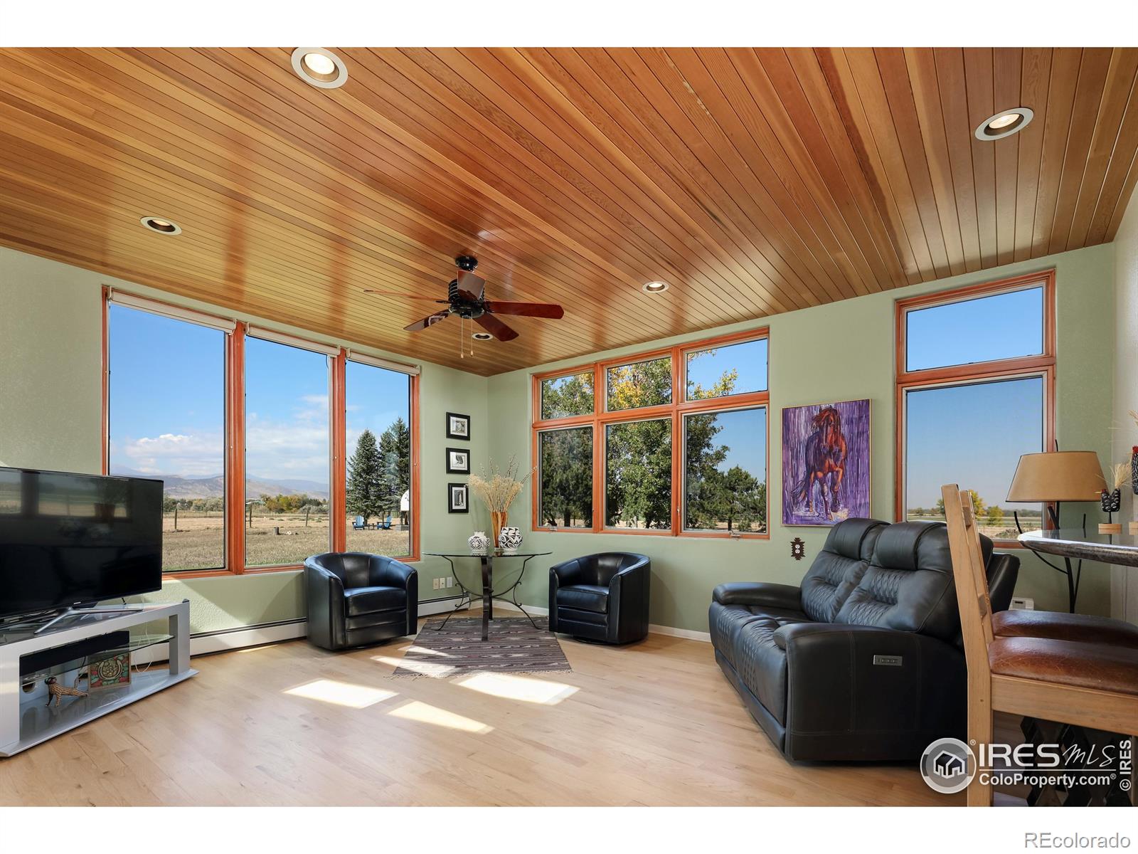 Eat-in kitchen drenched in natural sunlight and views