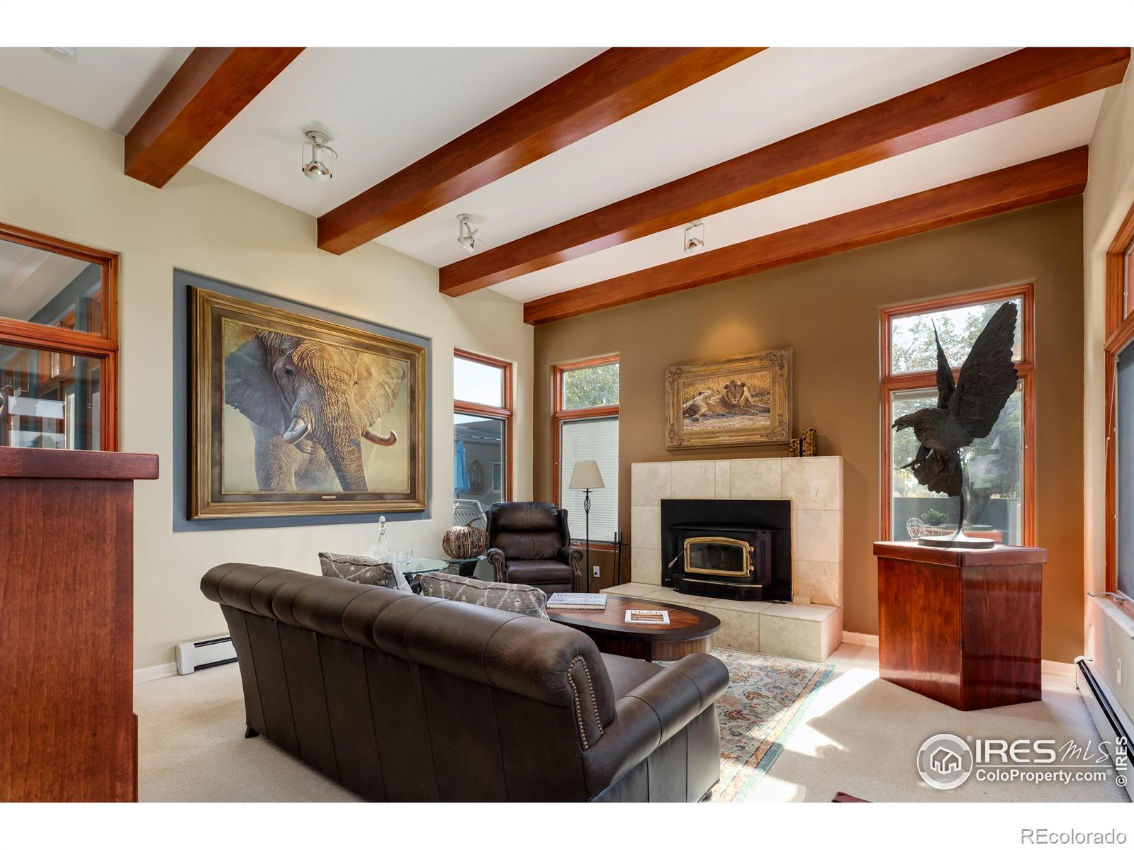 Warmly lit family room with sliders to the west facing back patio.