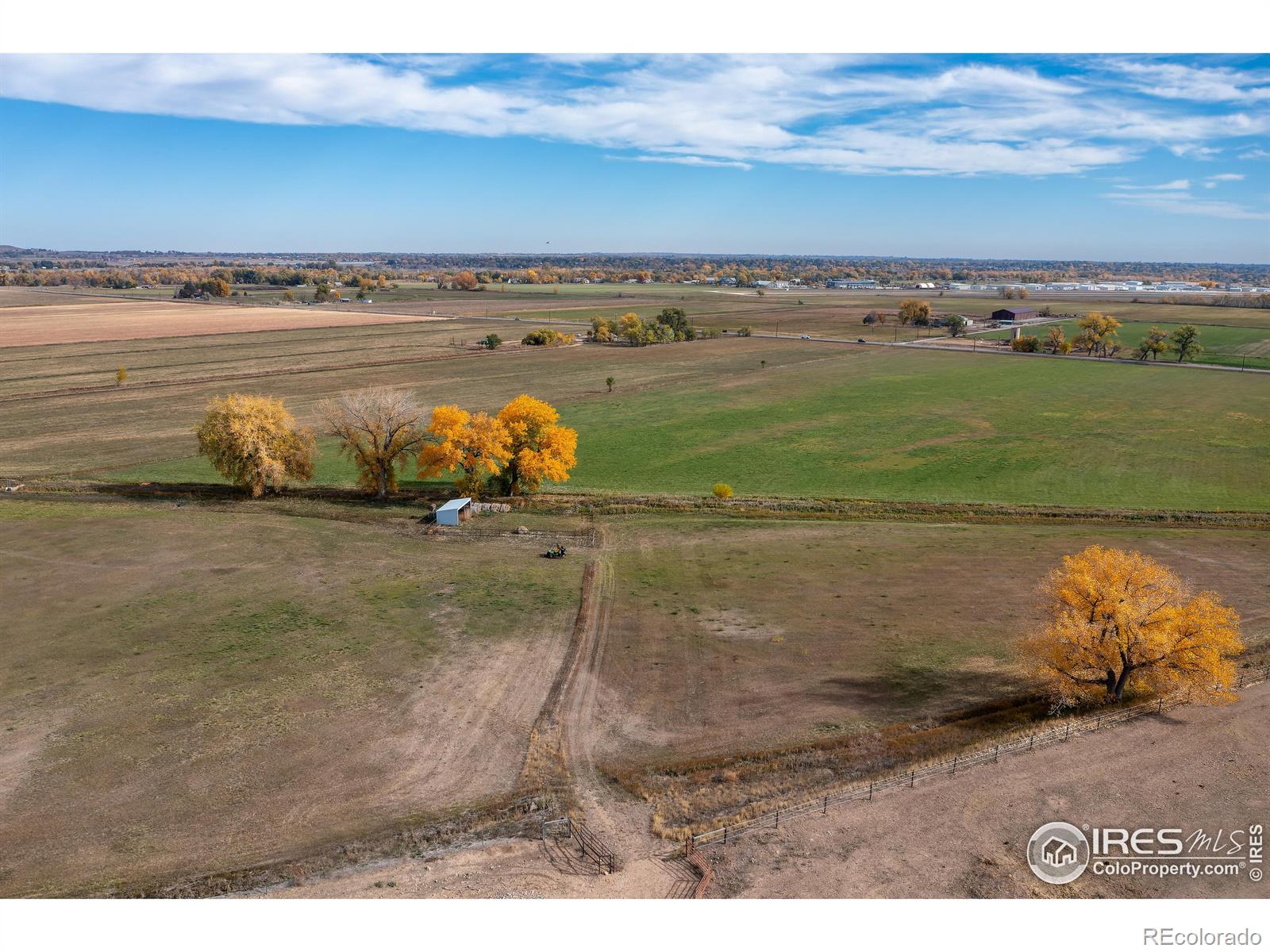 60 acres w/ flowing water rights, hay fields, arena, barn, paddock, home, shed, ADU and protected by Boulder County Conservation easements to the north and private farmland to the west