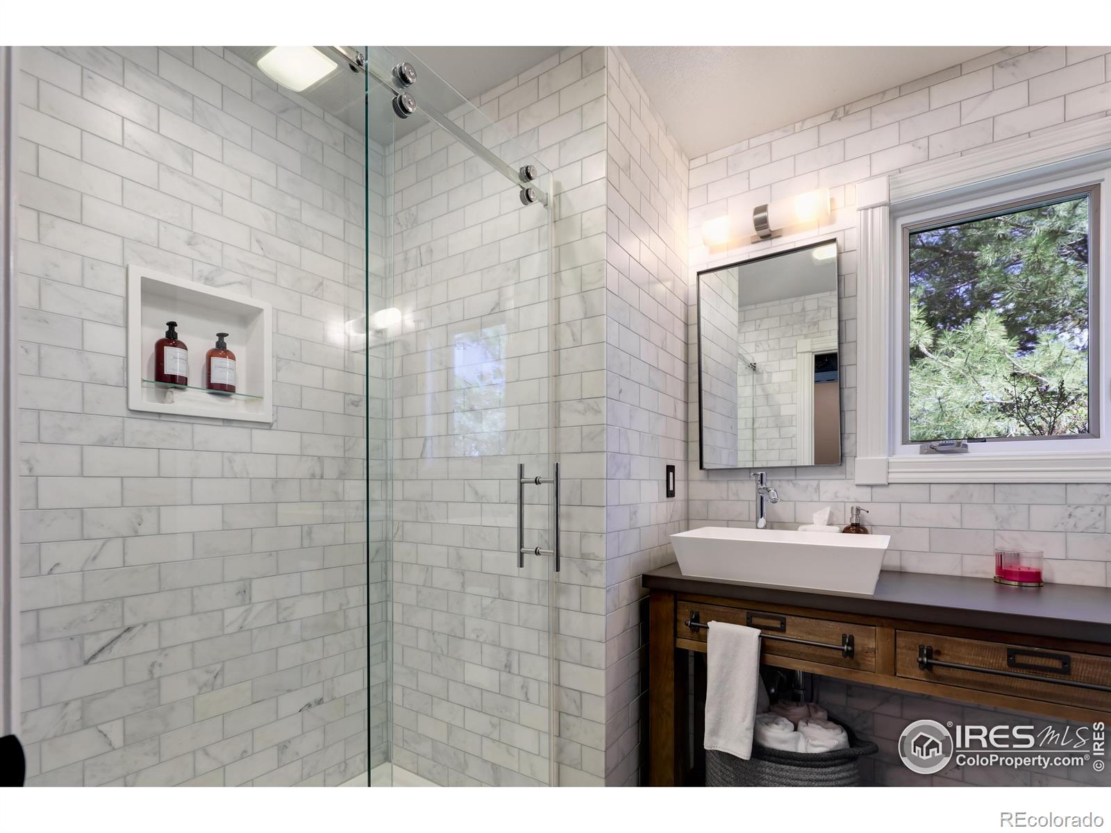 Bathroom 3 with dual MTI sinks & RH Vanity, MTI Stone shower basin w/ Graff hardware, marble tile surround & Italian tile flooring expert mason stoned