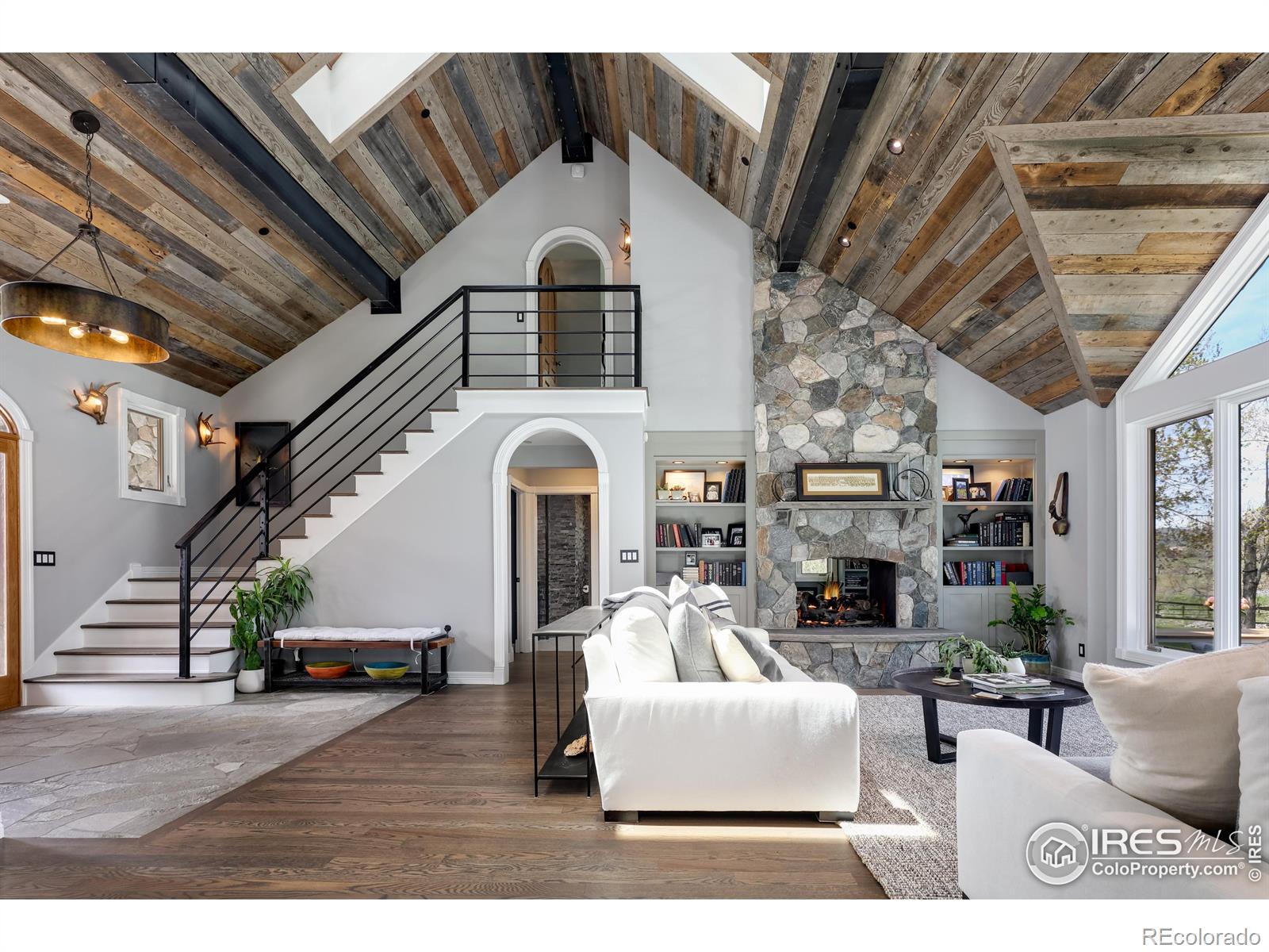 Inviting and embracing at every turn. Warm oak floors. Reclaimed barnwood vaulted ceilings. Metal accents.