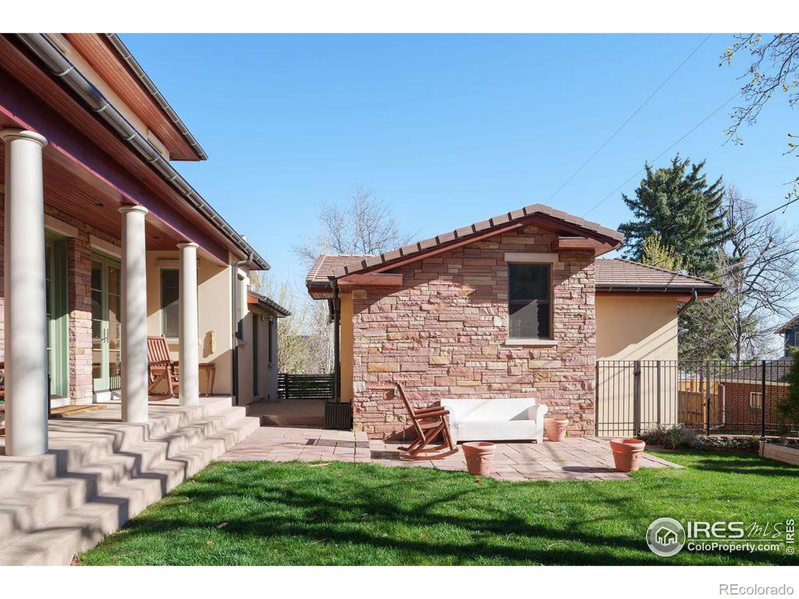 Lush yard and detached garage and studio.