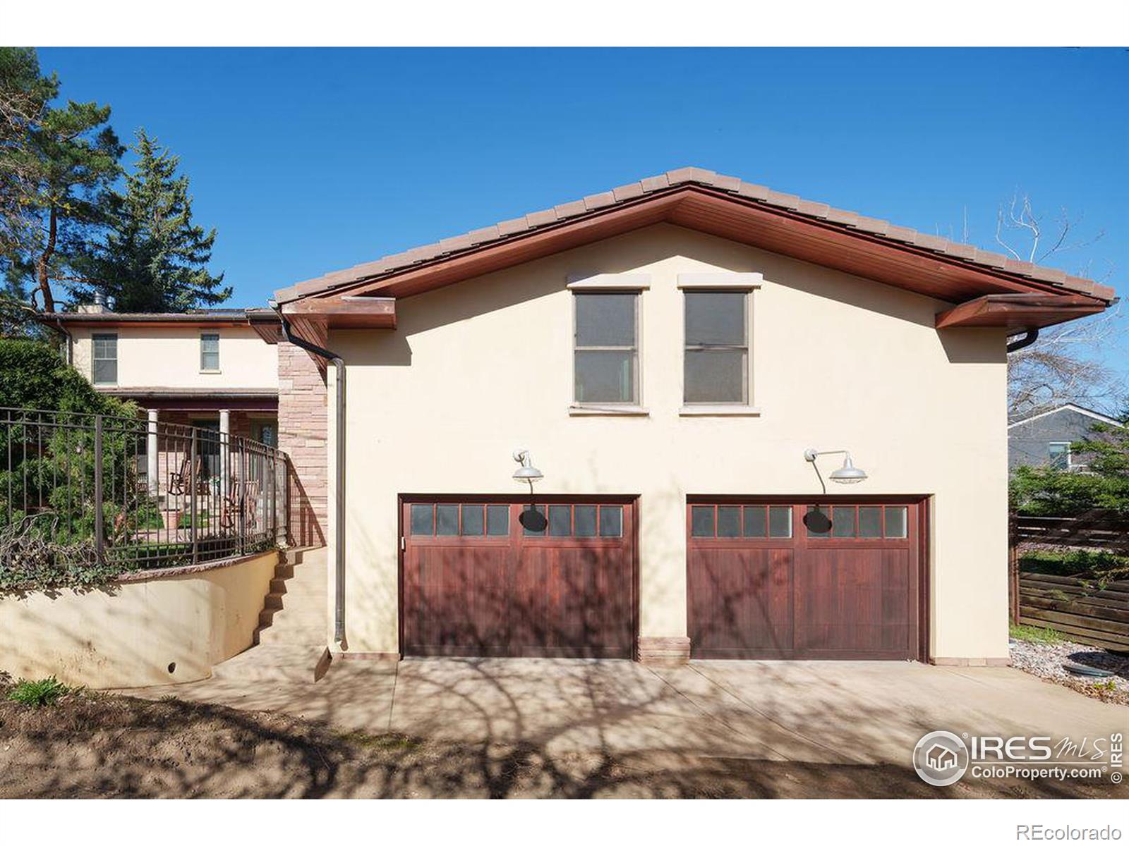 The detached two-car garage provides alley access and off-street parking.