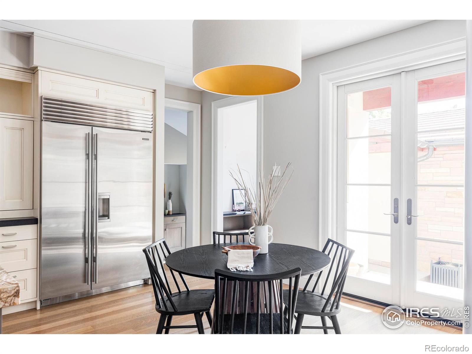 A sunny breakfast area, an adjacent office nook/home command center and mudroom complete the kitchen wing.