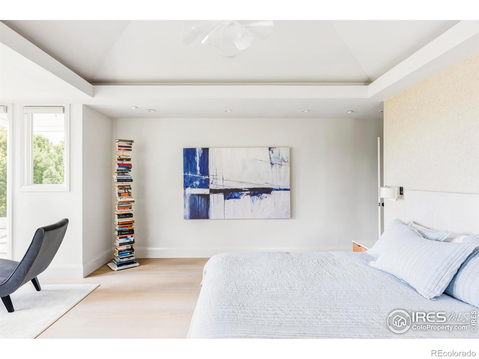 Illuminated tray ceilings to the king-size bedroom and sitting area.