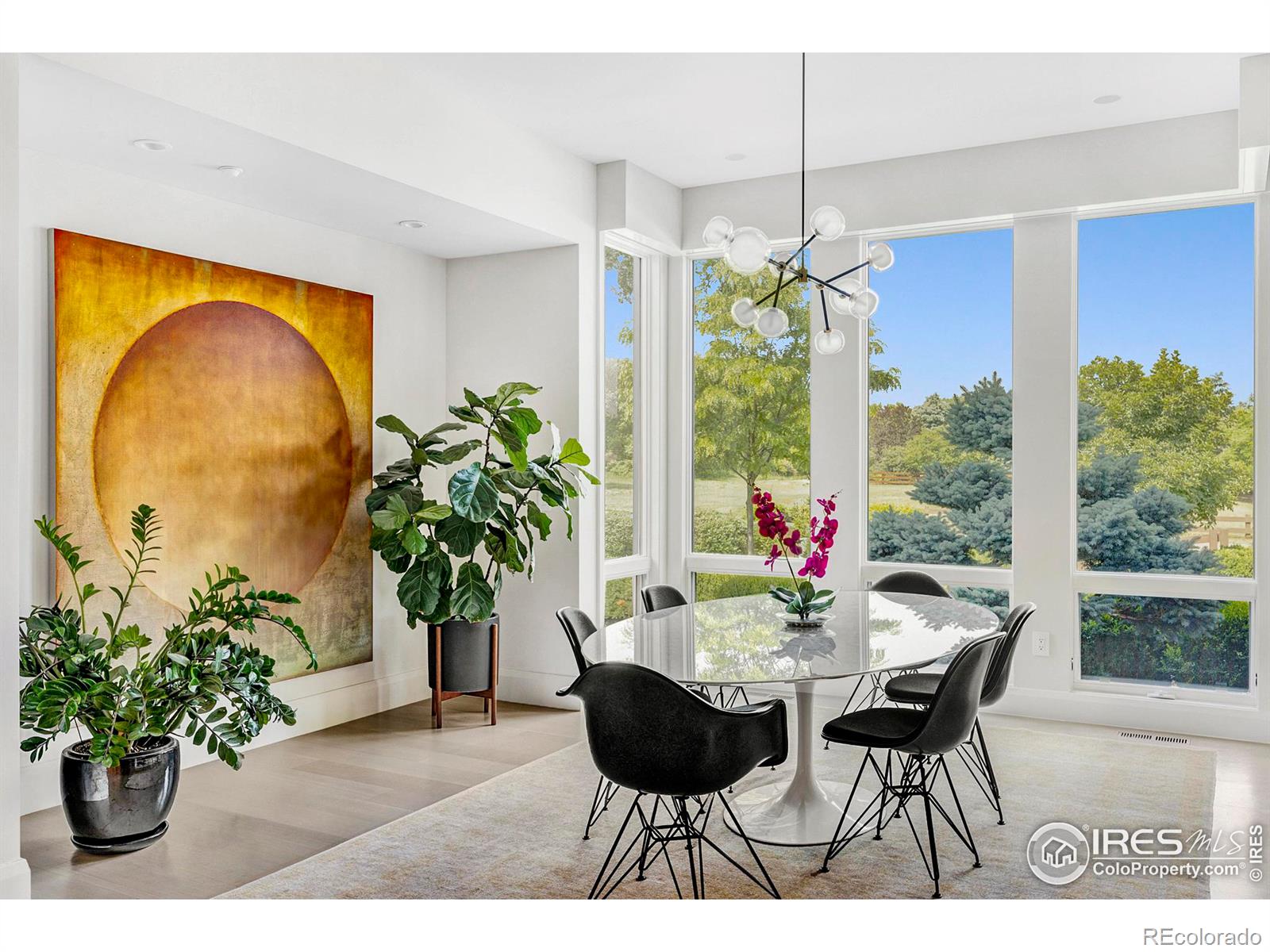 Plan dinner parties in an inviting formal dining room flanked by a buffet counter, wet bar, walnut cabinets and verdant views.