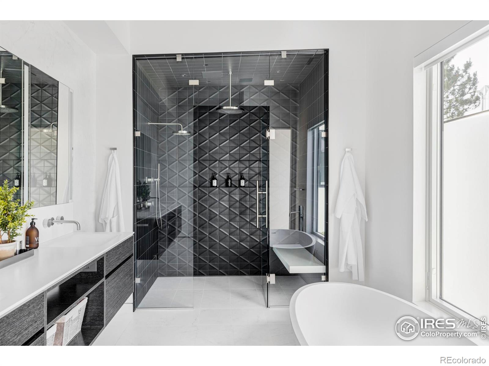 The en suite bathroom is a spa-inspired oasis.