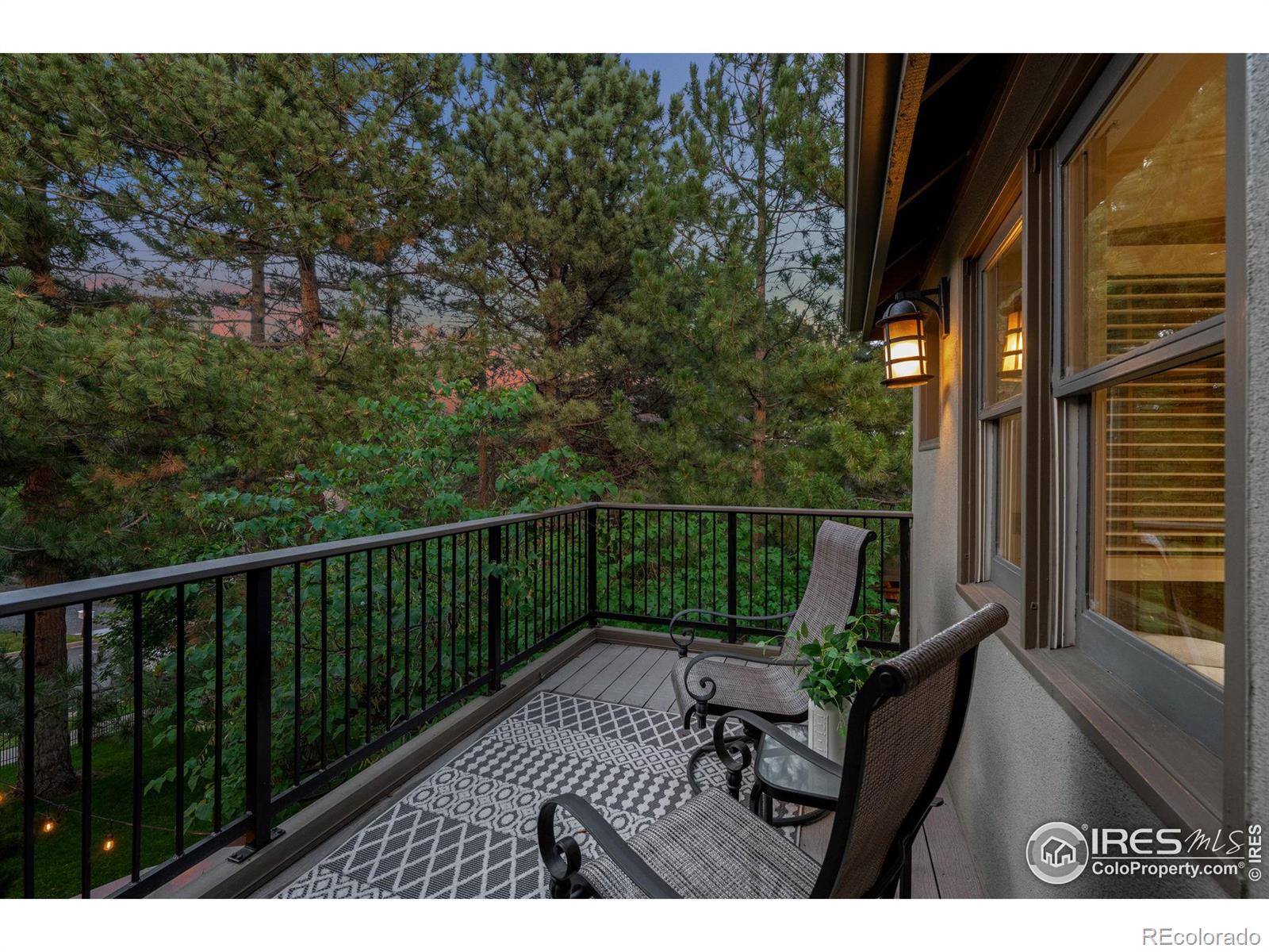 Mountain living in an urban environment with a primary suite private deck that looks onto the Flatirons.