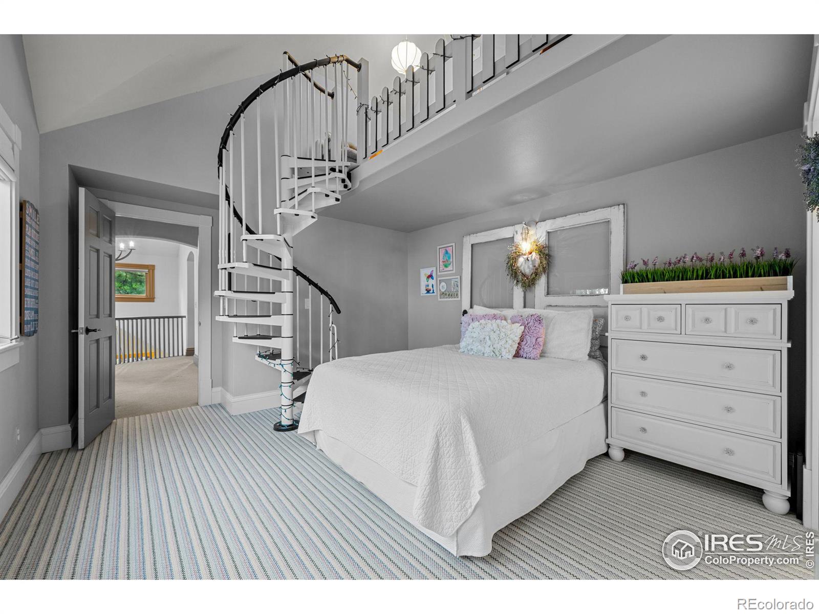 Upper-level suite, with great bath and cool stairway to heaven to a private loft.