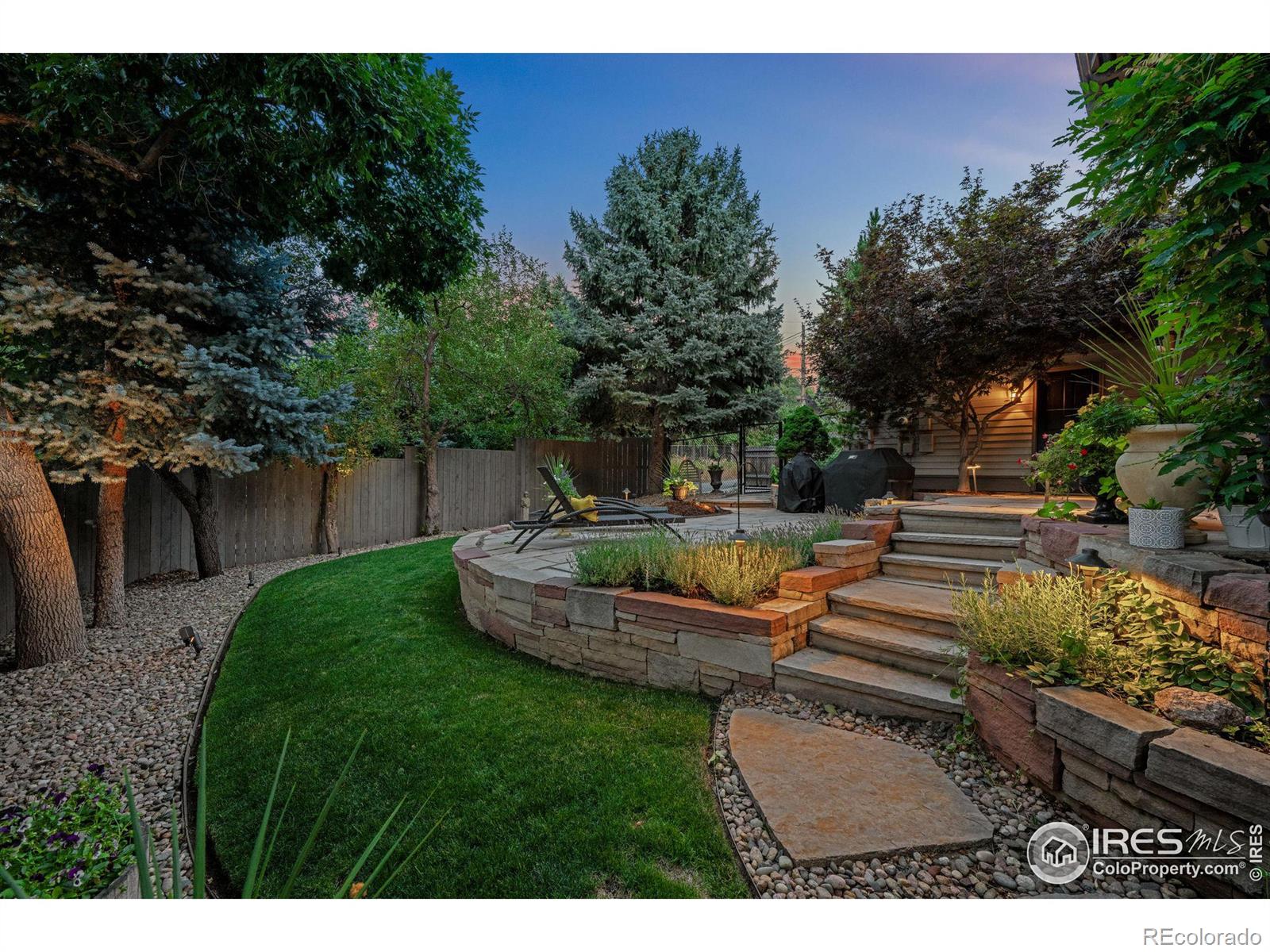 Mature trees give privacy in this protected backyard.