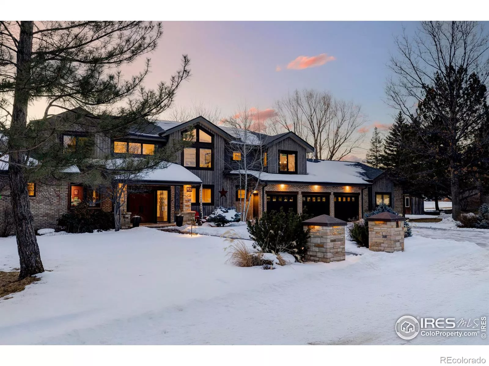 Experience the stunning beauty of this luxury mountain modern home, featuring exteriors with custom stone and lush landscaping.