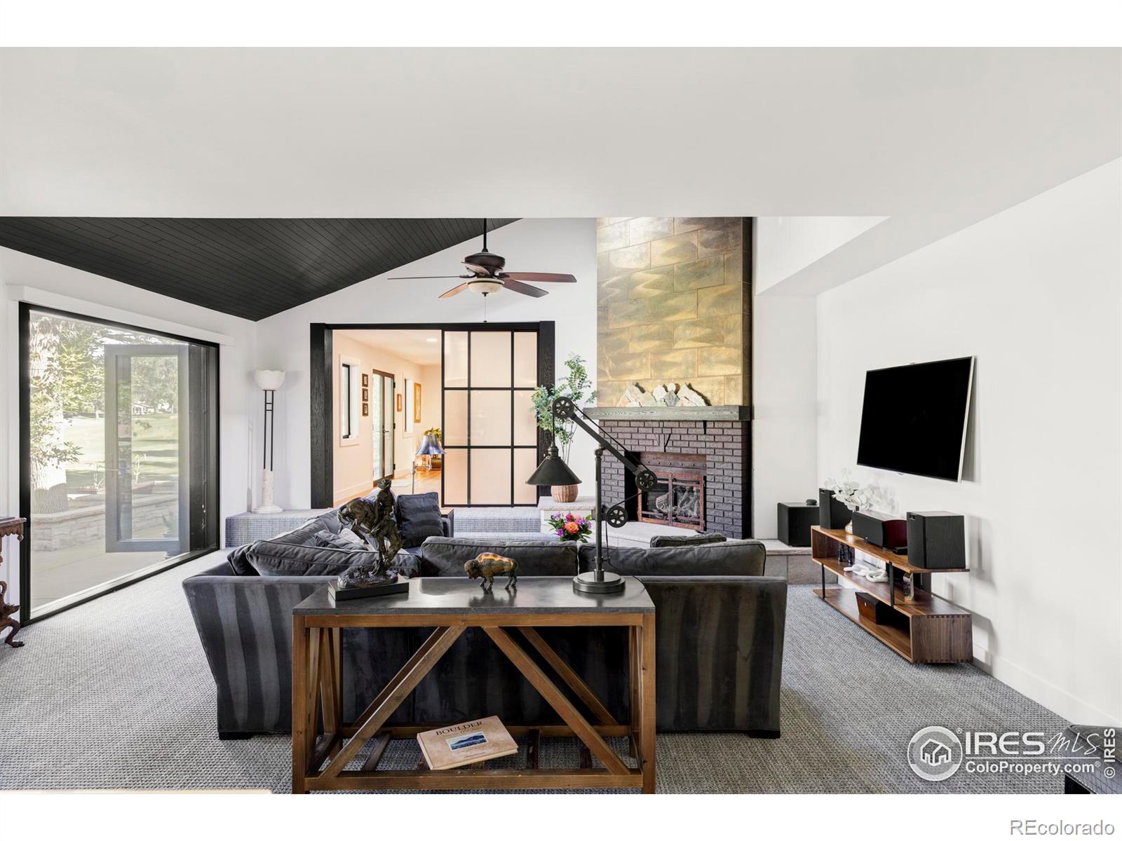 A stunning kitchen with gleaming custom cabinetry seamlessly connects to the family room, a cozy breakfast nook and a walk-in pantry.