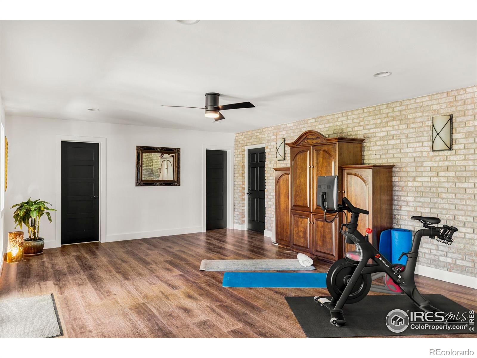 The inviting family room with gas fireplace connects to an expansive back patio area and an additional flex room.