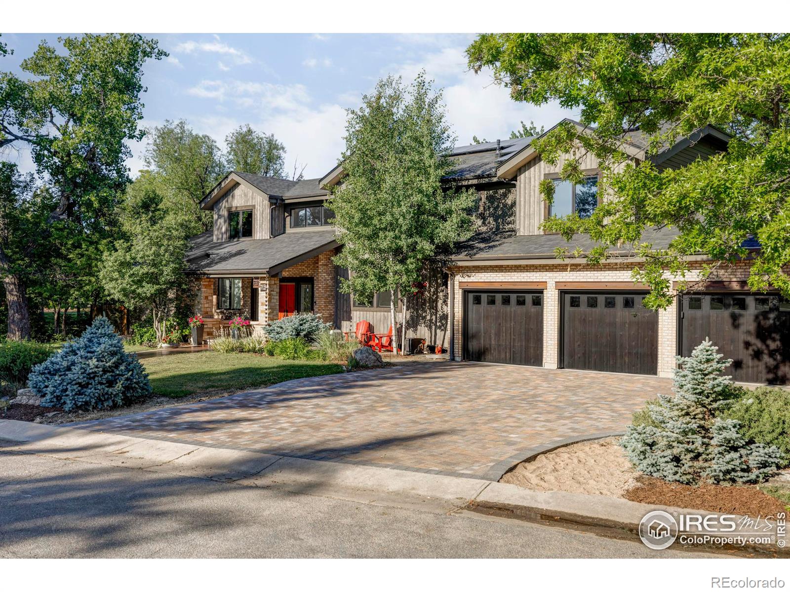 This property boasts a new paver driveway and a spacious five-stall garage.