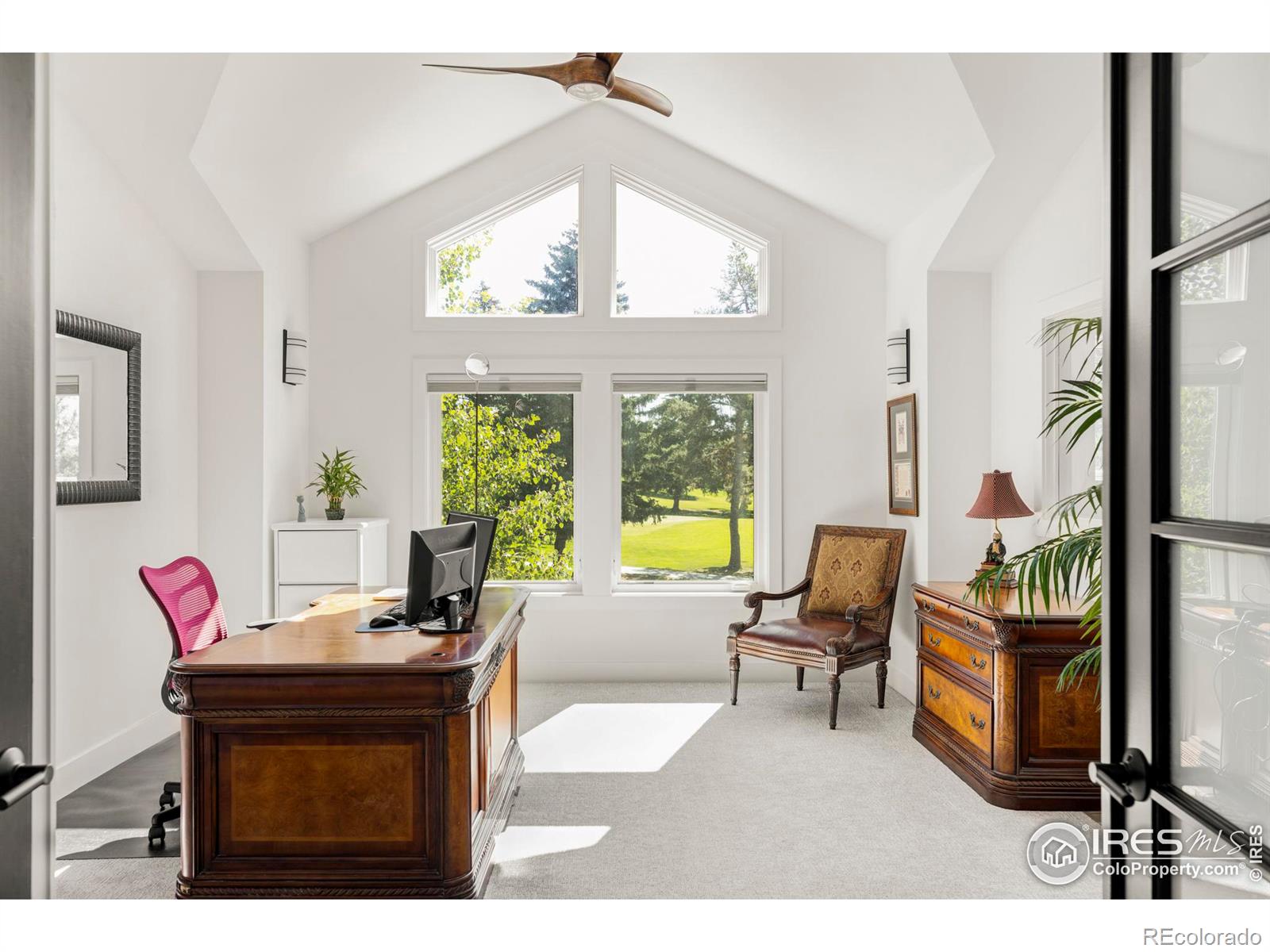 The luxurious primary bathroom features a soaking tub and walk-in steam shower.