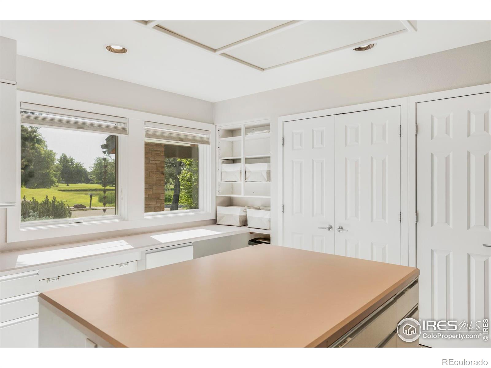 The third upper level ensuite bathroom has its own unique design style, with custom tile and vanity.