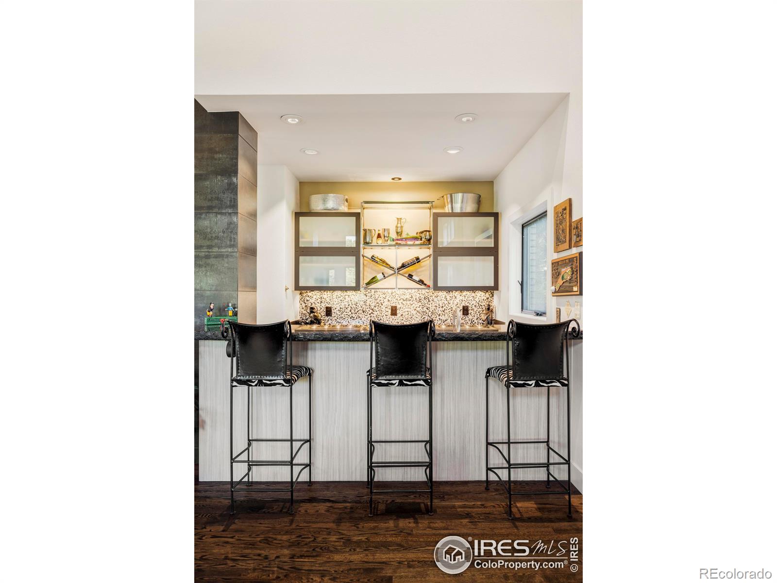 A stunning wet bar provides the perfect centerpiece for hosting unforgettable gatherings.