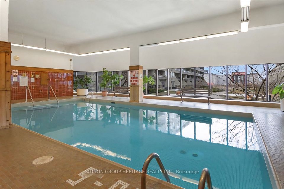 Large indoor pool with outdoor view