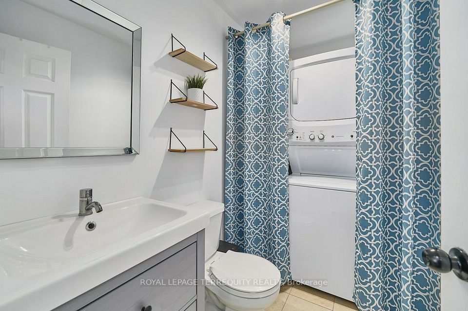 Main floor powder room combined with laundry area