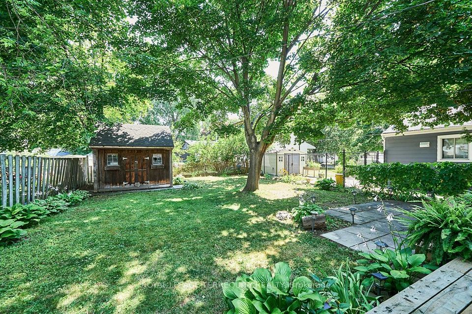 Mature backyard with garden shed and patio